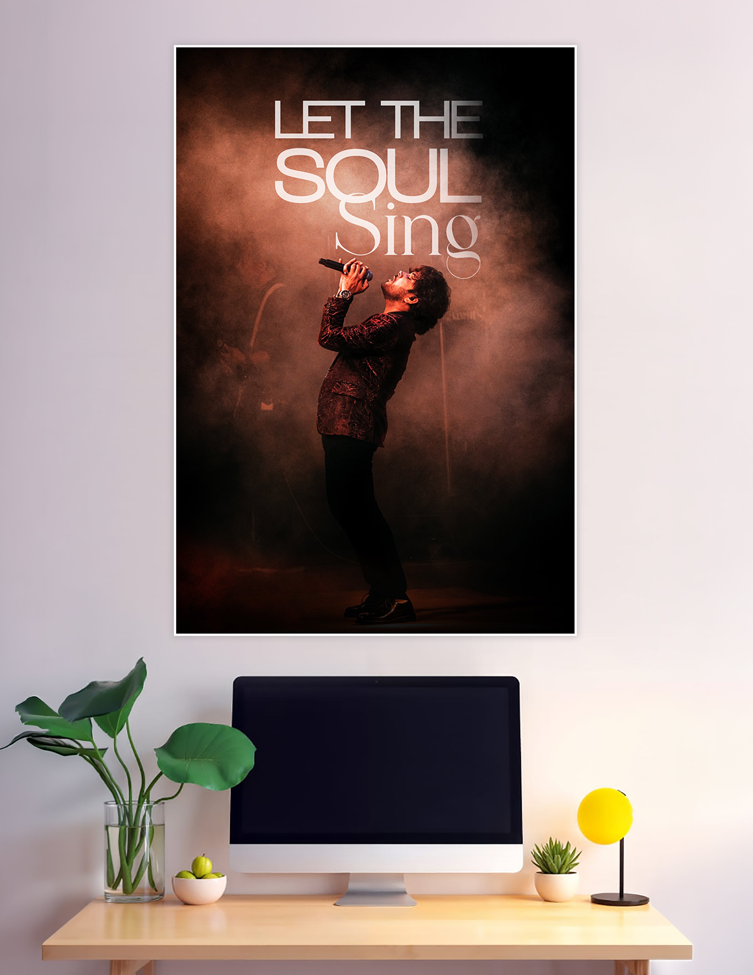 Male vocalist singing on stage with amber smoke lighting