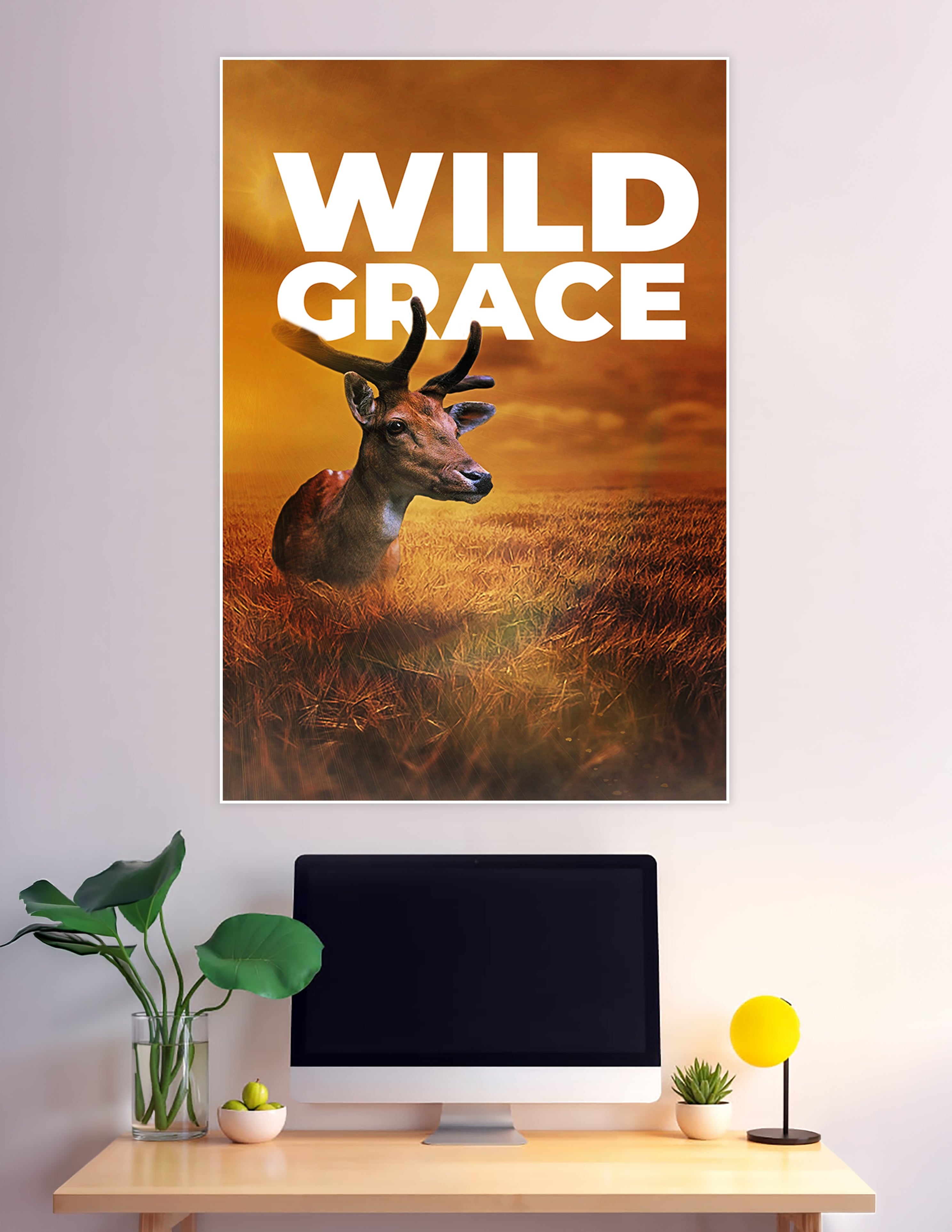 Wild Grace poster featuring a majestic deer resting in a golden wheat field under a dramatic amber sunset sky