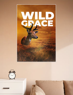 Wild Grace poster featuring a majestic deer resting in a golden wheat field under a dramatic amber sunset sky