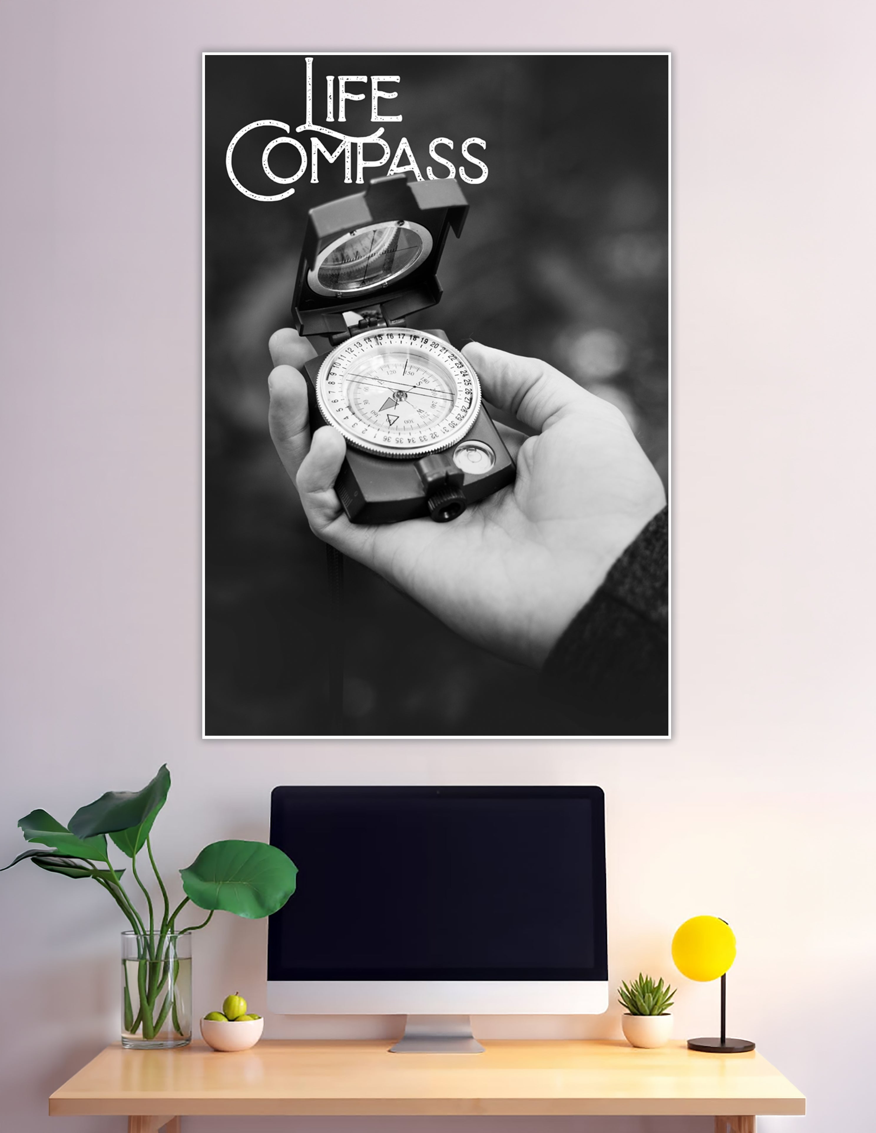 Black and white poster showing a hand holding a military compass with bold Life Compass typography overlay