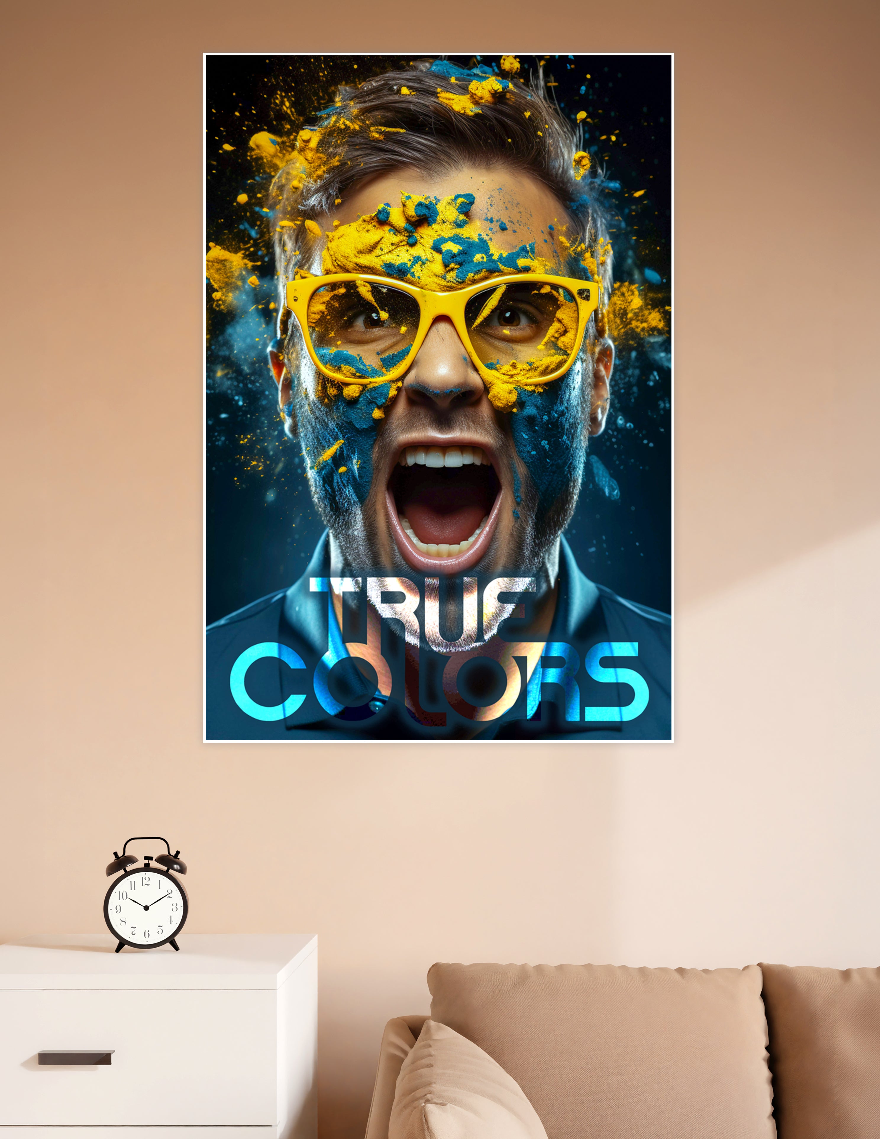 Man with yellow glasses covered in exploding yellow and teal powder with bold True Colors typography on dark background