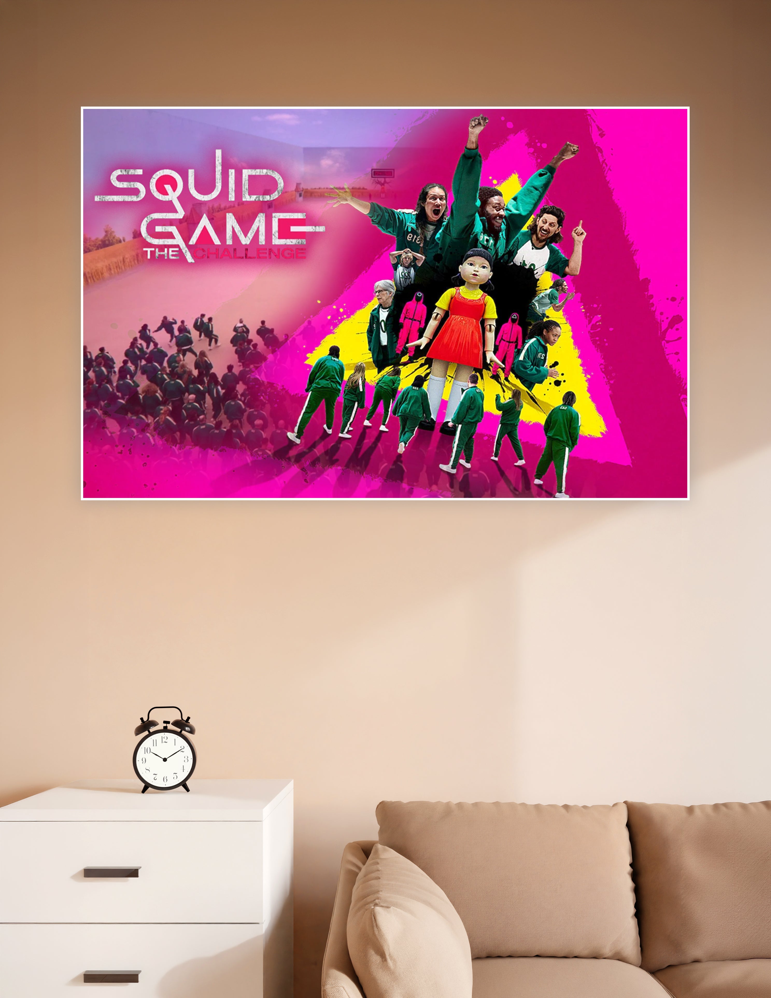 Squid Game The Challenge official Netflix poster featuring contestants in green tracksuits, the giant Young-hee doll, and masked guards on a vibrant pink and yellow background