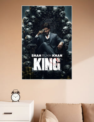 Shah Rukh Khan seated on a skull-adorned dark throne in a pinstripe suit, holding a card, with the title KING displayed below — cinematic Bollywood movie poster