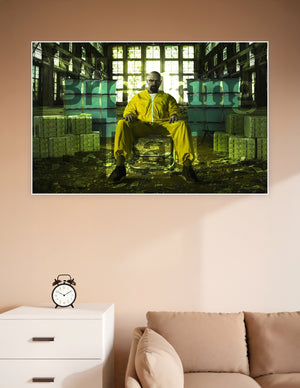 Breaking Bad promotional poster showing Walter White as Heisenberg seated in a yellow hazmat suit surrounded by stacks of cash in a dramatic industrial warehouse with green-tinted lighting