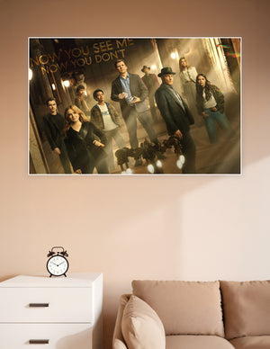 Now You See Me Now You Don't movie poster featuring the full ensemble cast in a dramatic golden-lit theatrical setting
