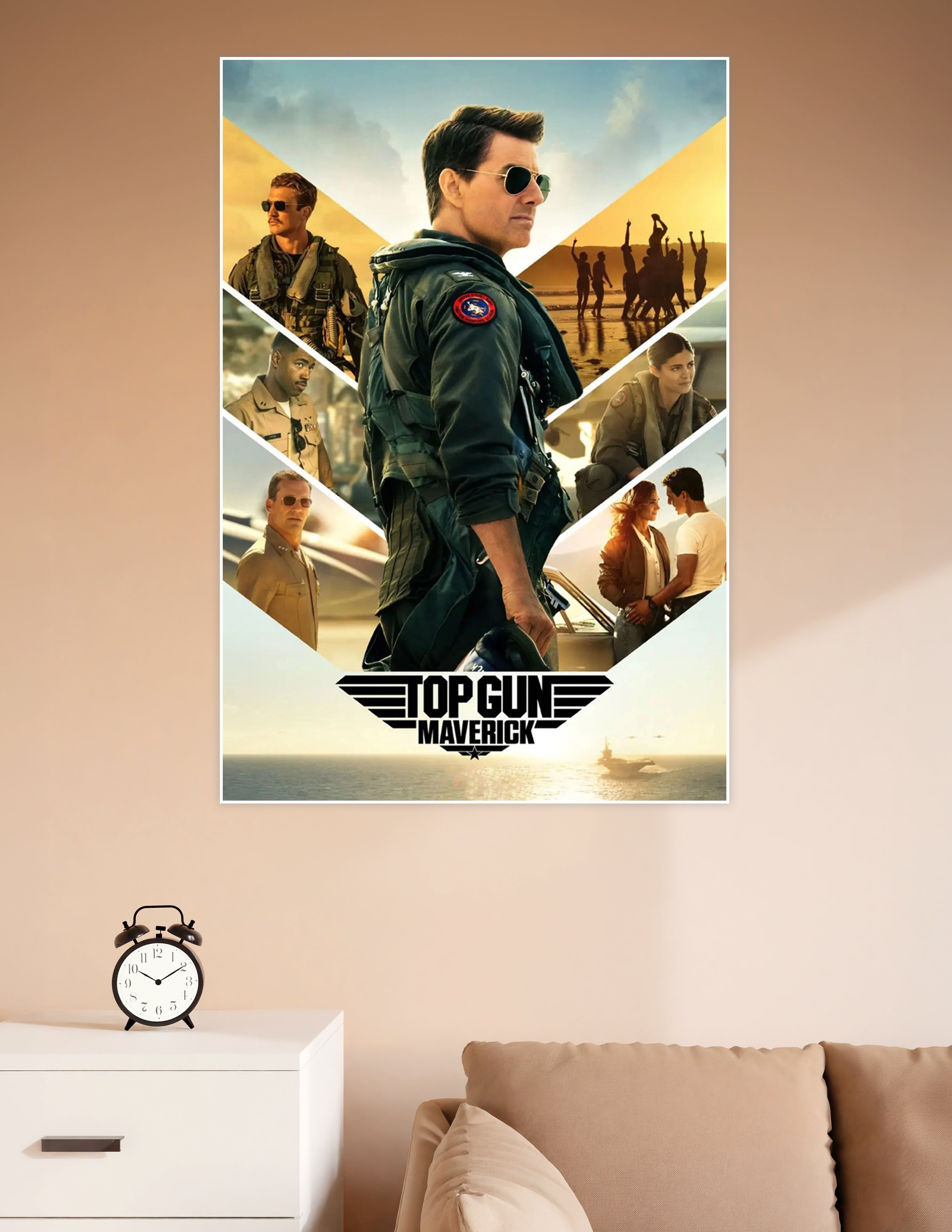Top Gun Maverick official movie poster featuring the lead pilot in flight gear with aviator sunglasses, surrounded by cast members in a bold chevron layout with golden cinematic tones