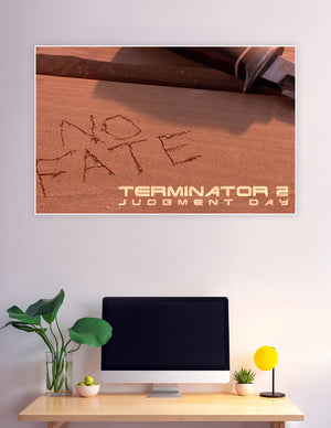 Terminator 2 Judgment Day movie poster showing 'No Fate' carved in sand with a knife in the background, warm amber tones