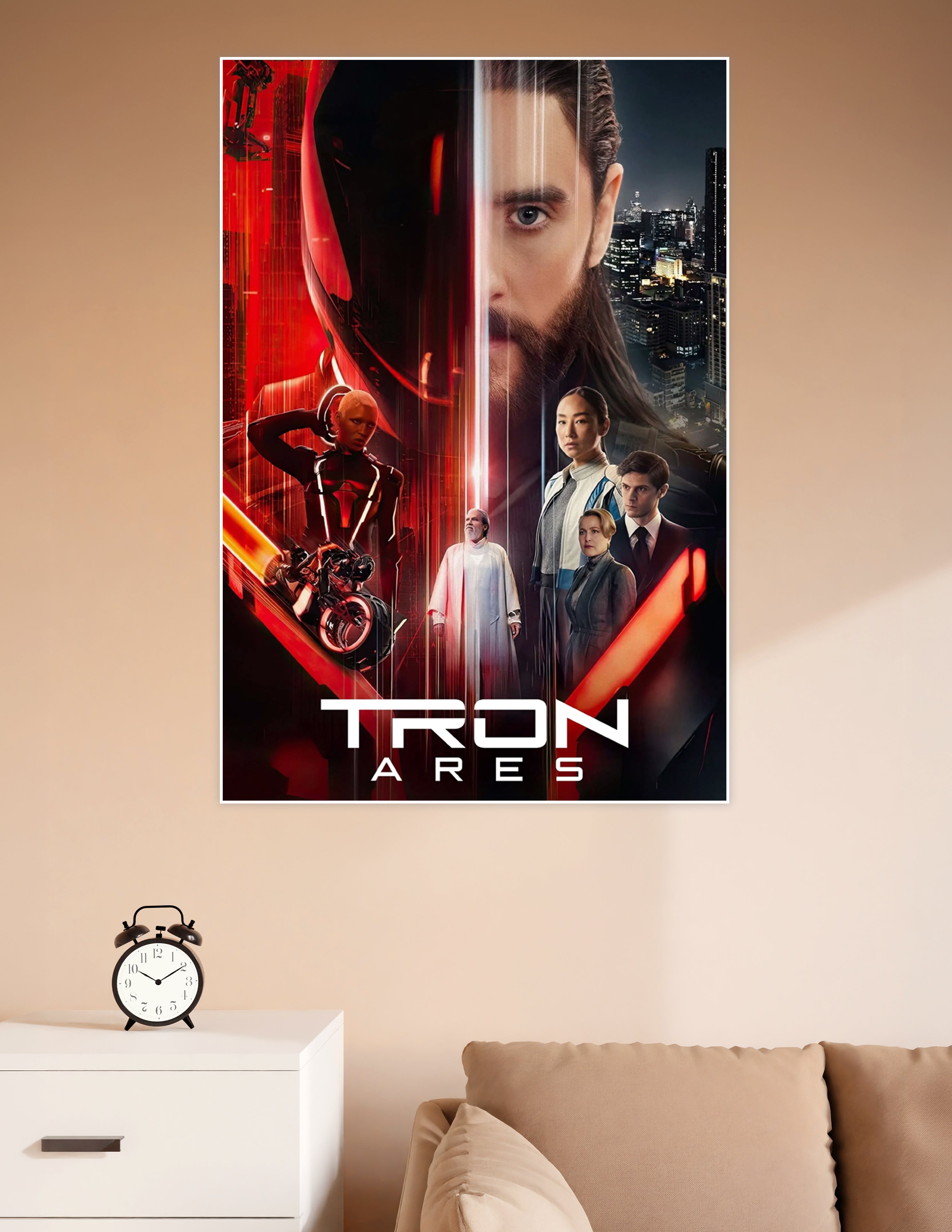 TRON Ares official movie poster featuring a bearded male lead, neon red Grid characters, light cycle, and futuristic cityscape on a dark dramatic background