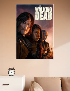The Walking Dead official poster featuring Daryl Dixon, Michonne, and Carol against a dramatic fiery apocalyptic sky background