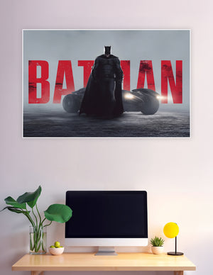 Batman standing before Batmobile with bold red typography