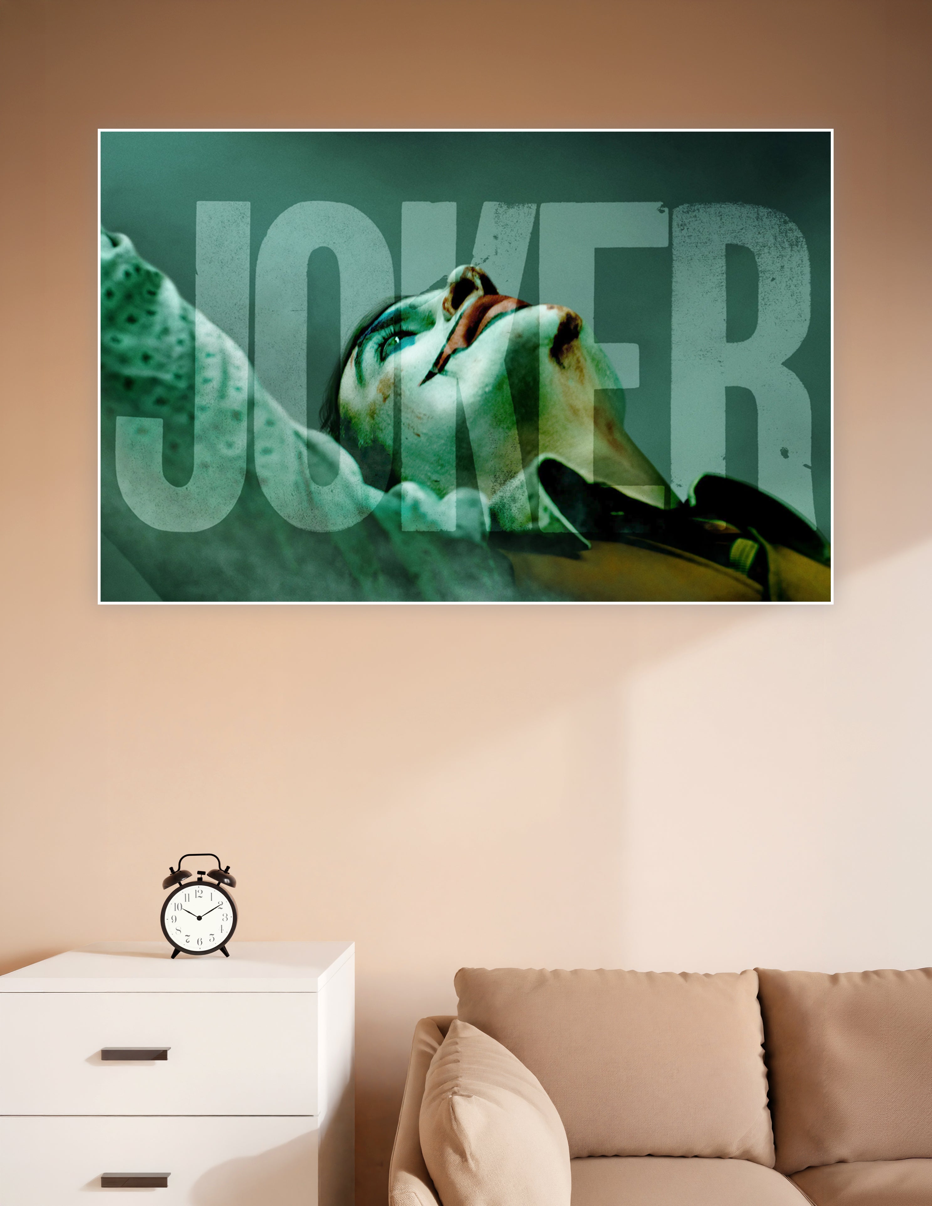 Dramatic close-up Joker movie poster with distressed JOKER typography in teal and dark tones on matte board