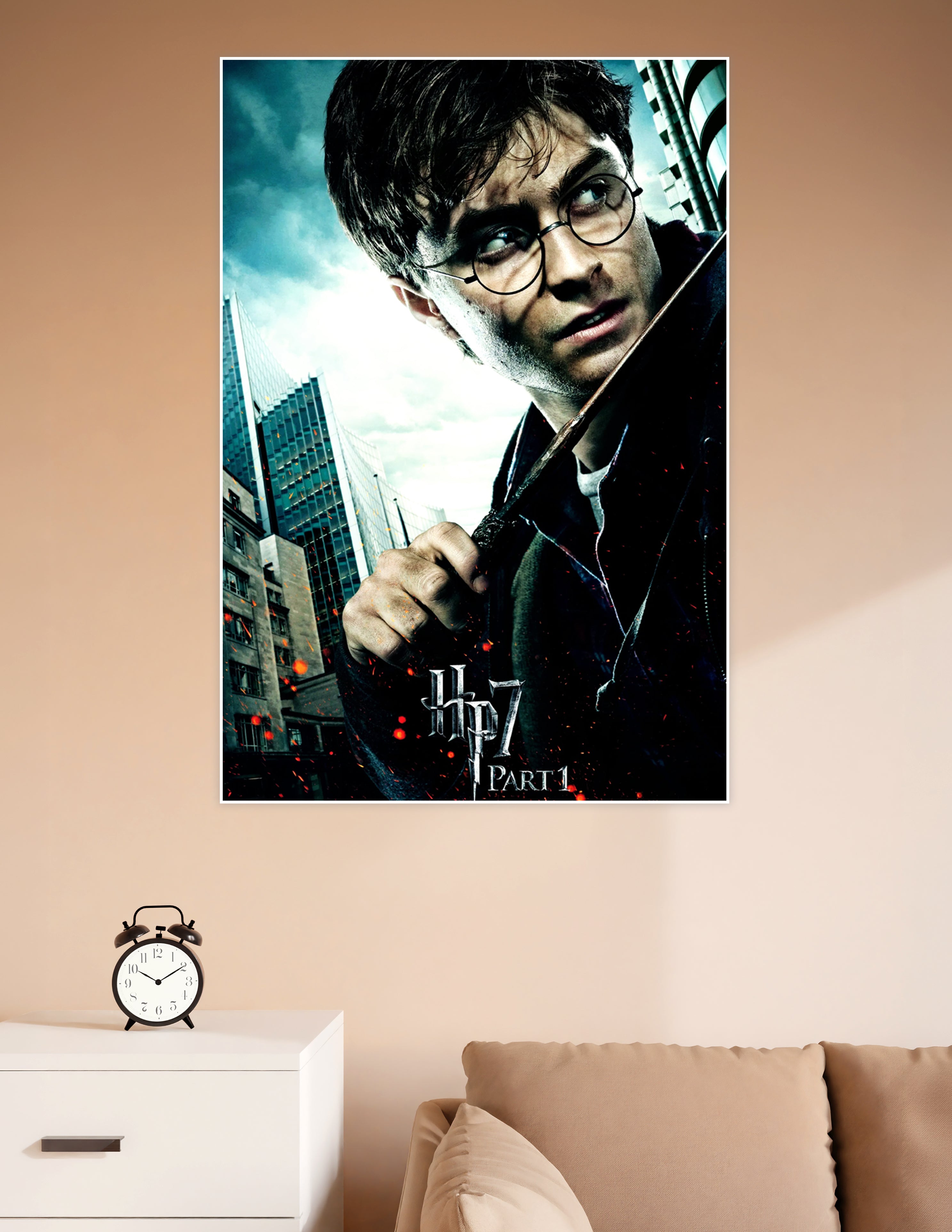 Harry Potter gripping his wand in a dramatic battle-ready pose on the HP7 Deathly Hallows Part 1 movie poster with stormy cityscape background