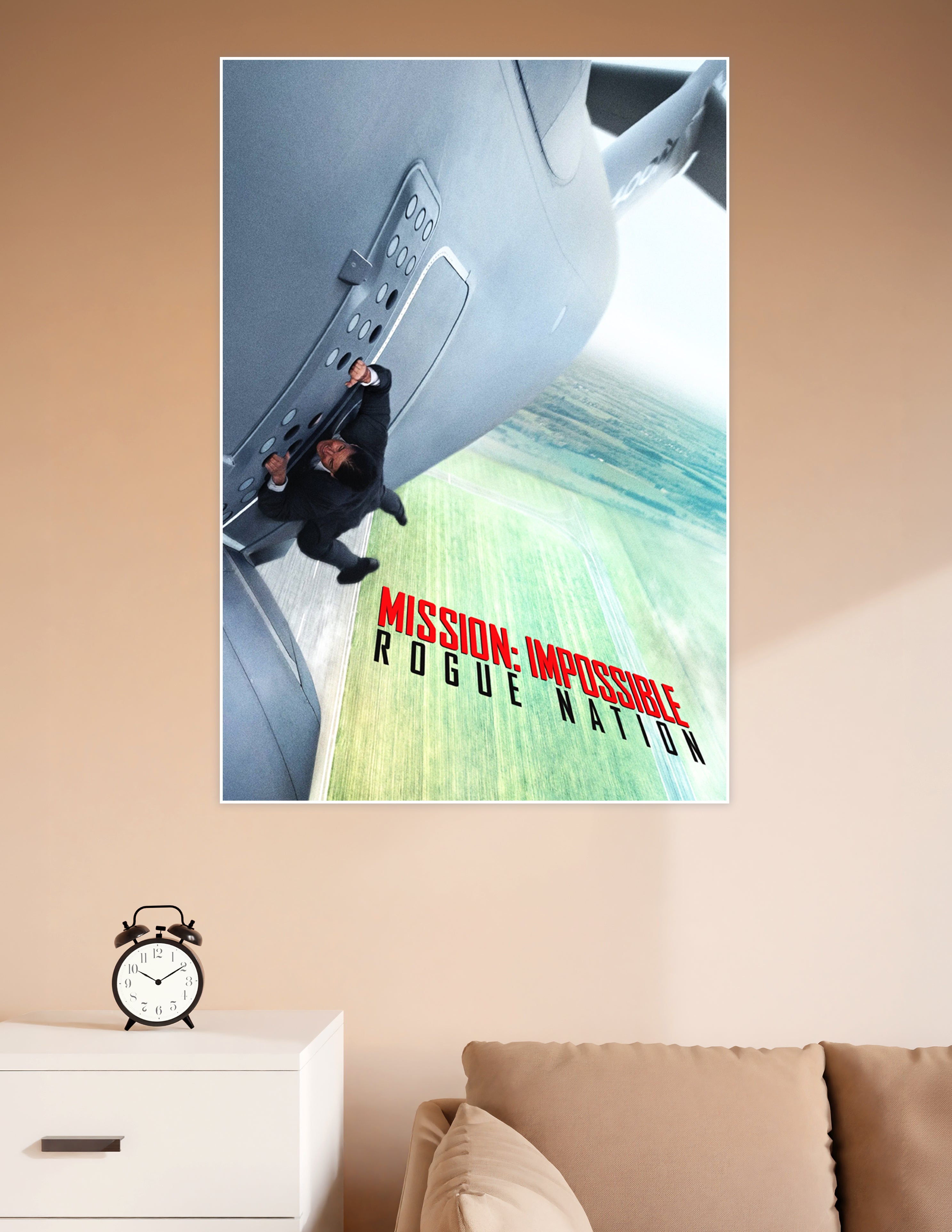 Mission Impossible Rogue Nation movie poster showing a man clinging to the door of a large aircraft in flight with bold red and black title text