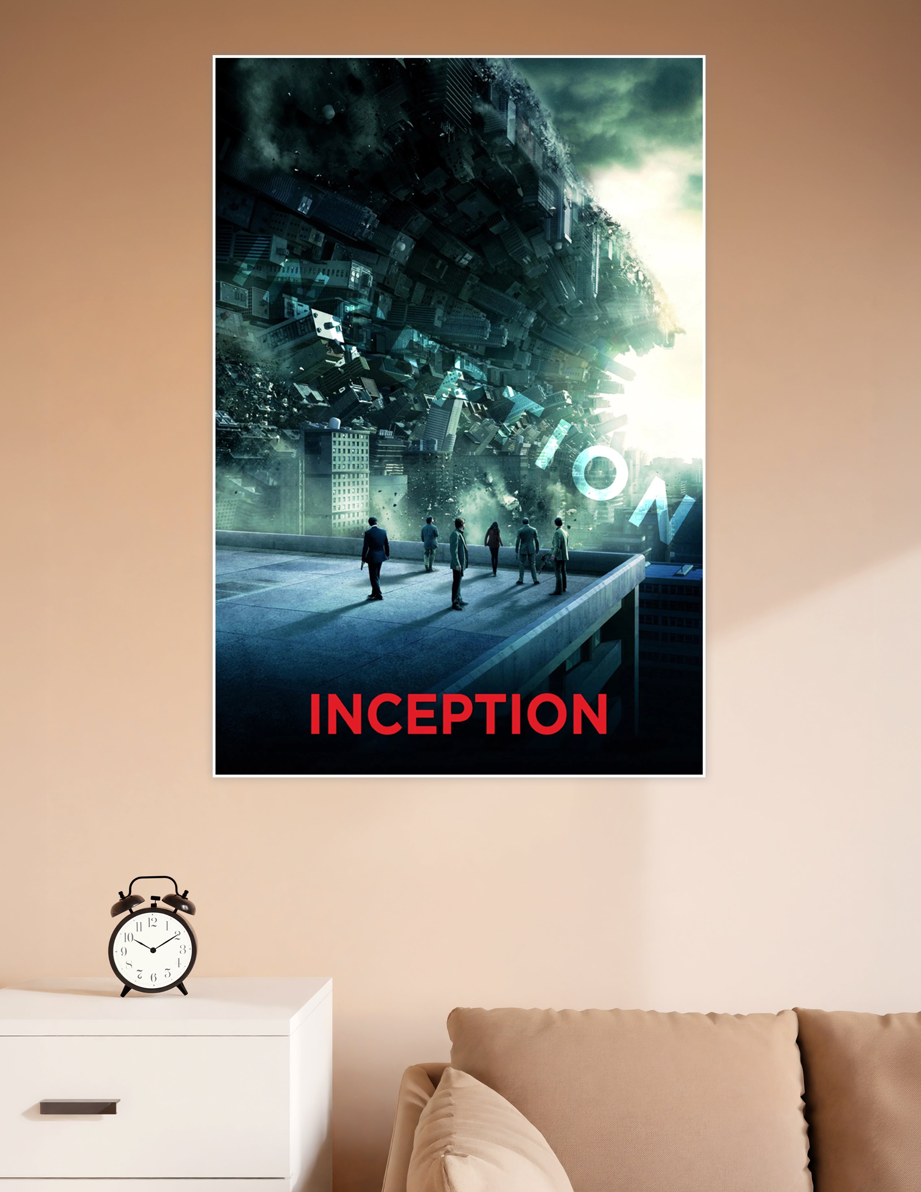 Inception movie poster showing six silhouetted figures on a rooftop watching a massive city fold and collapse into a surreal dreamscape under a glowing sky