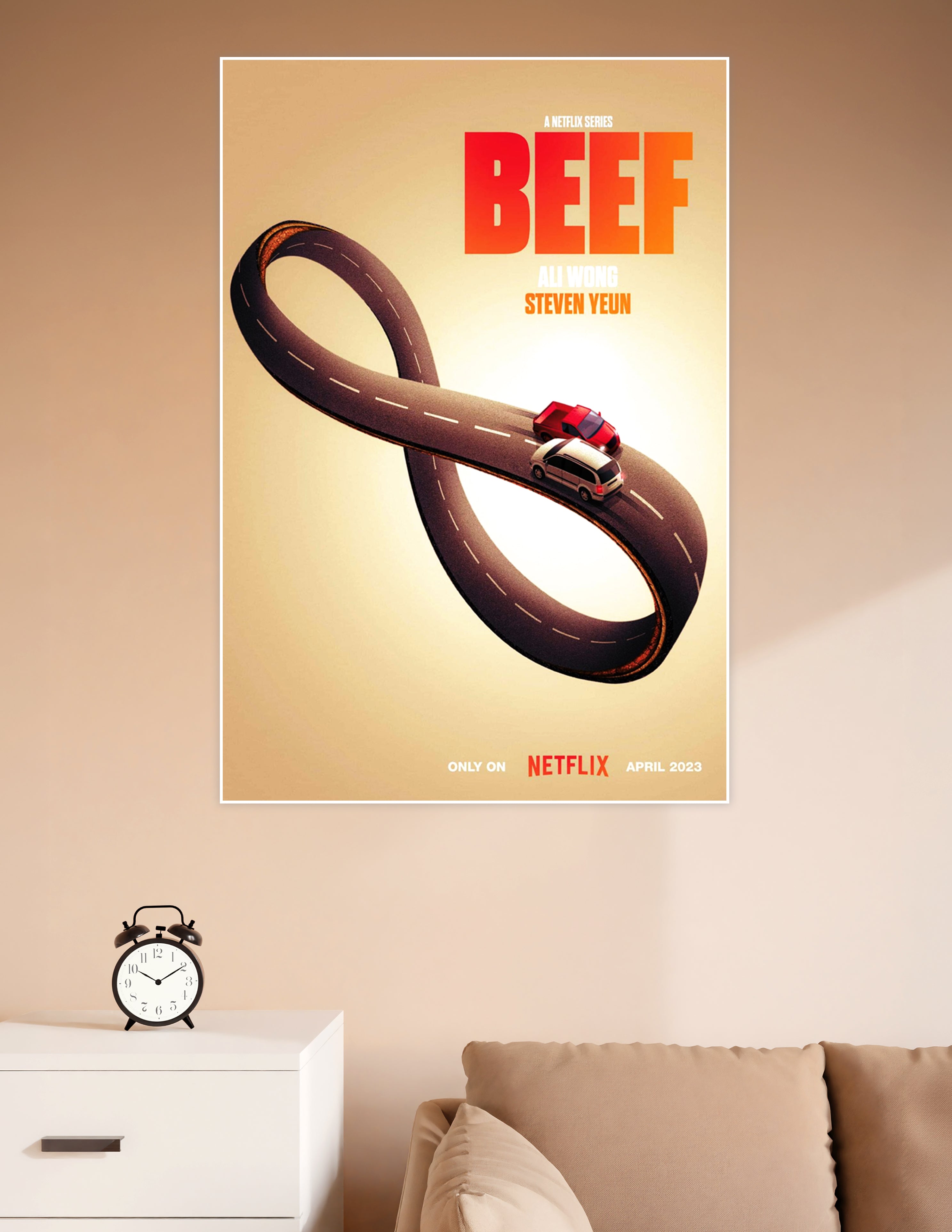 BEEF Netflix series promotional poster showing two cars on an infinity-shaped road with bold red title text and names Ali Wong and Steven Yeun on a warm golden background