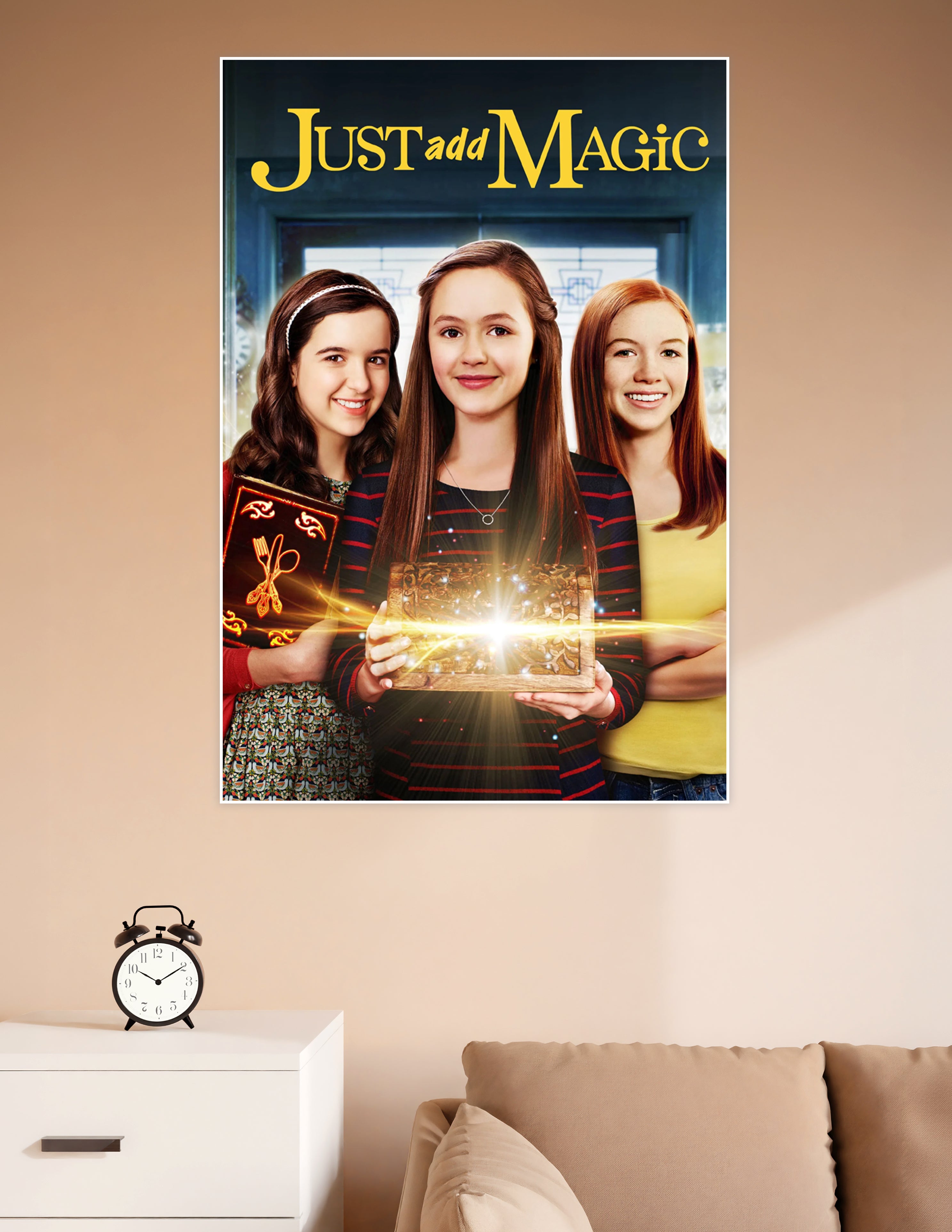 Just Add Magic Amazon Original series poster featuring three girls holding a glowing magical cookbook and chest with golden light effects
