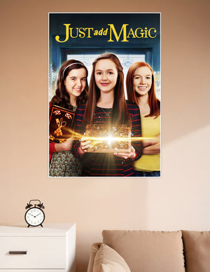 Just Add Magic Amazon Original series poster featuring three girls holding a glowing magical cookbook and chest with golden light effects