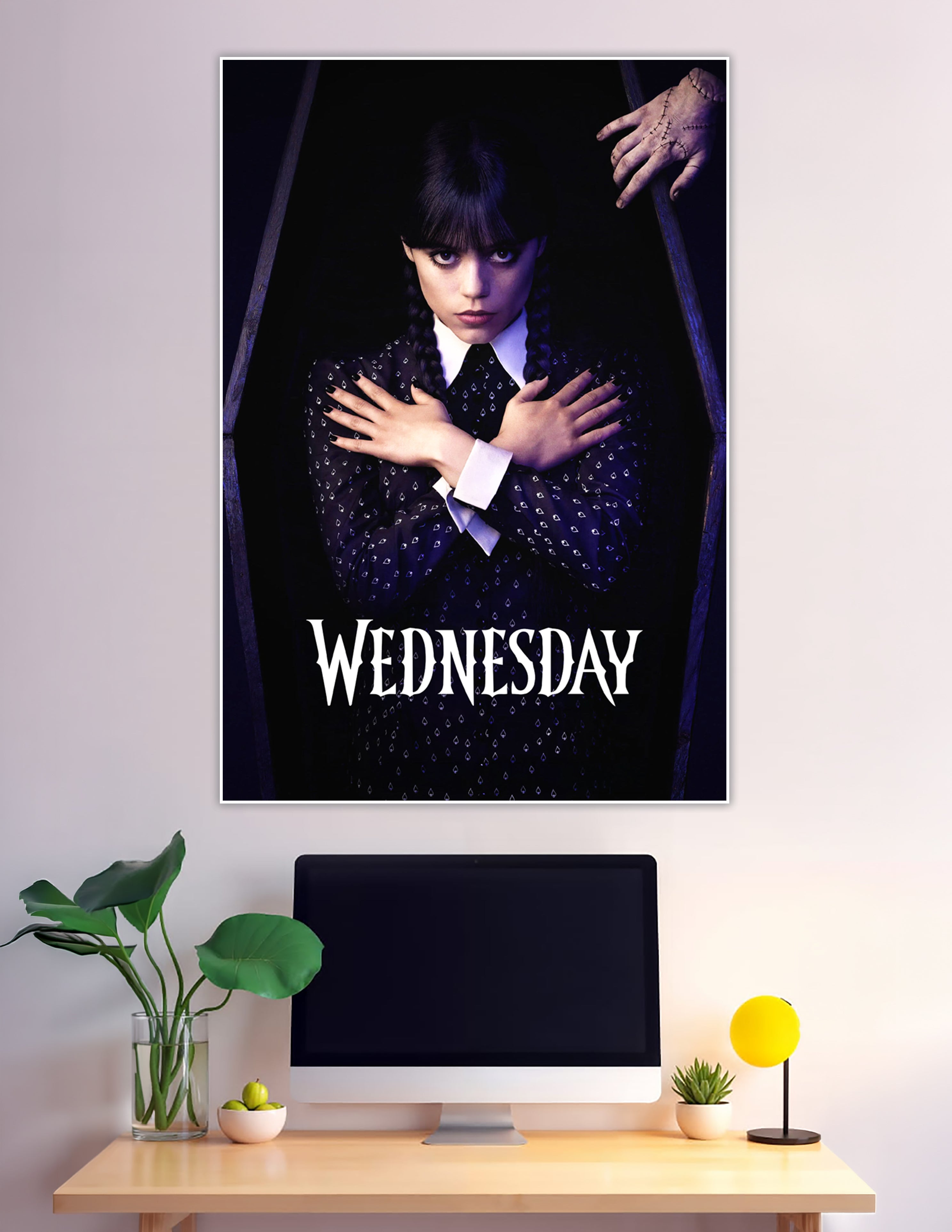 Wednesday Addams standing inside a coffin with arms crossed, wearing black dress with white collar, Thing visible above, official Netflix series poster