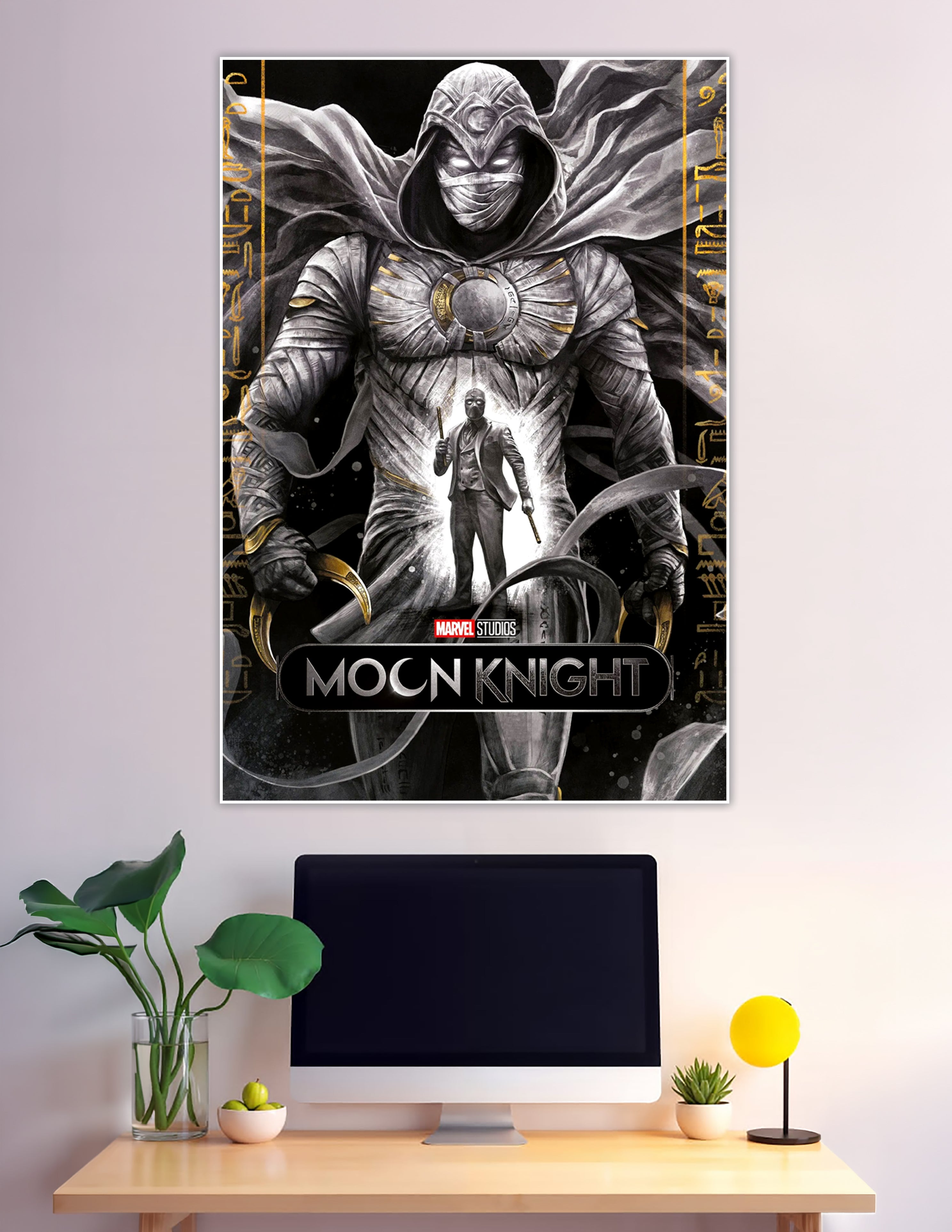 Moon Knight Marvel Studios poster featuring armored Moon Knight with glowing eyes, Egyptian hieroglyphic borders, gold accents, and alter ego figure in white suit