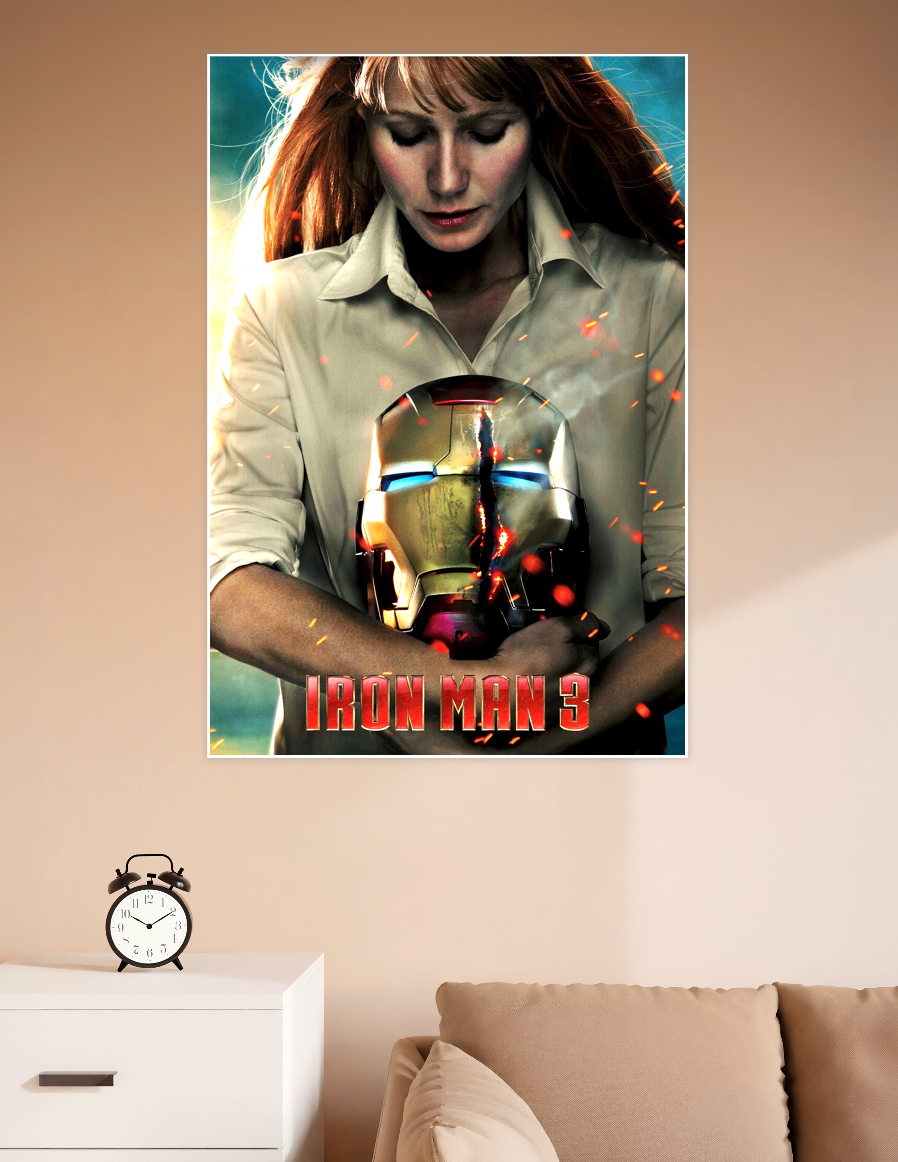 Iron Man 3 movie poster showing a red-haired woman holding a damaged glowing Iron Man helmet with sparks flying around her