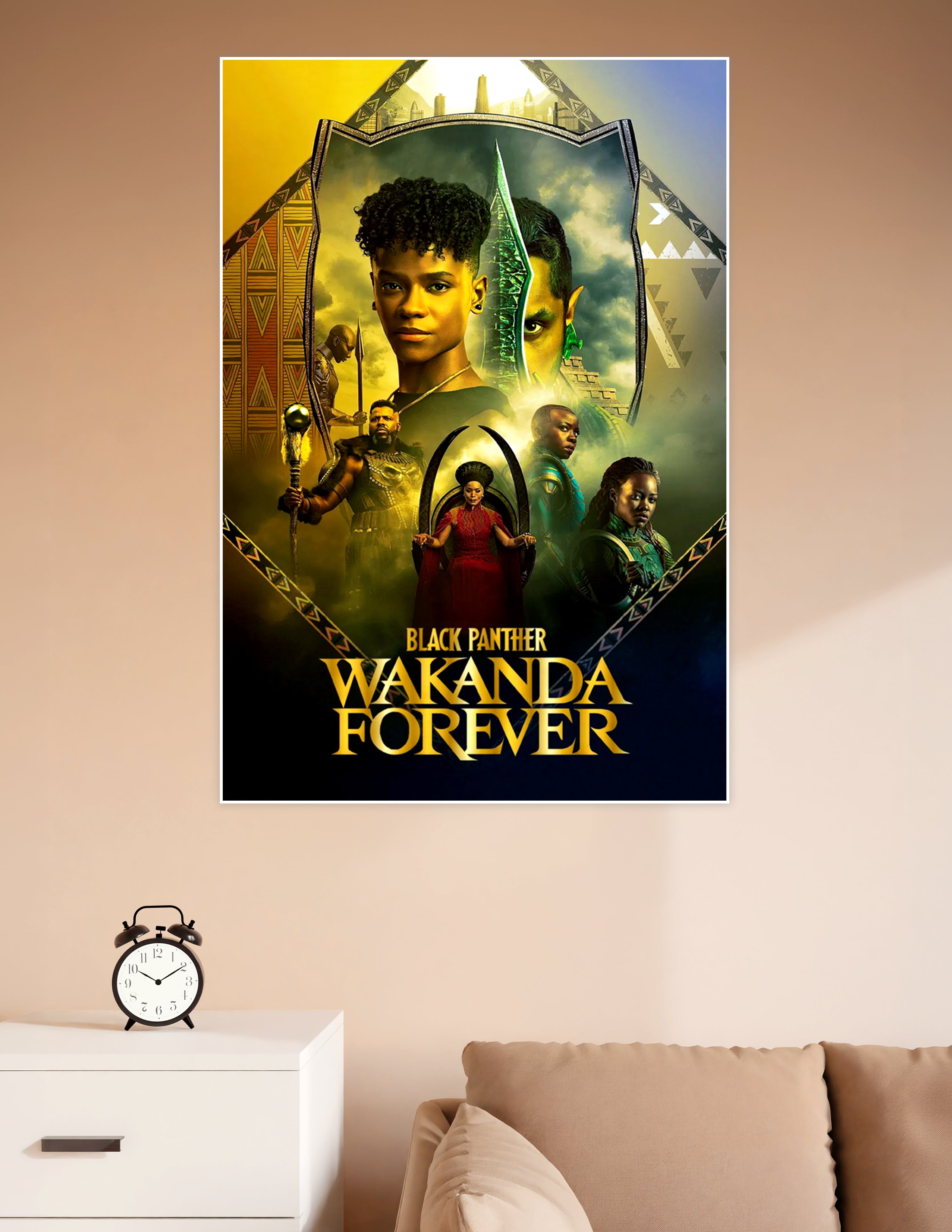 Black Panther Wakanda Forever official movie poster featuring the cast in gold and emerald tones with Wakandan tribal shield frame design