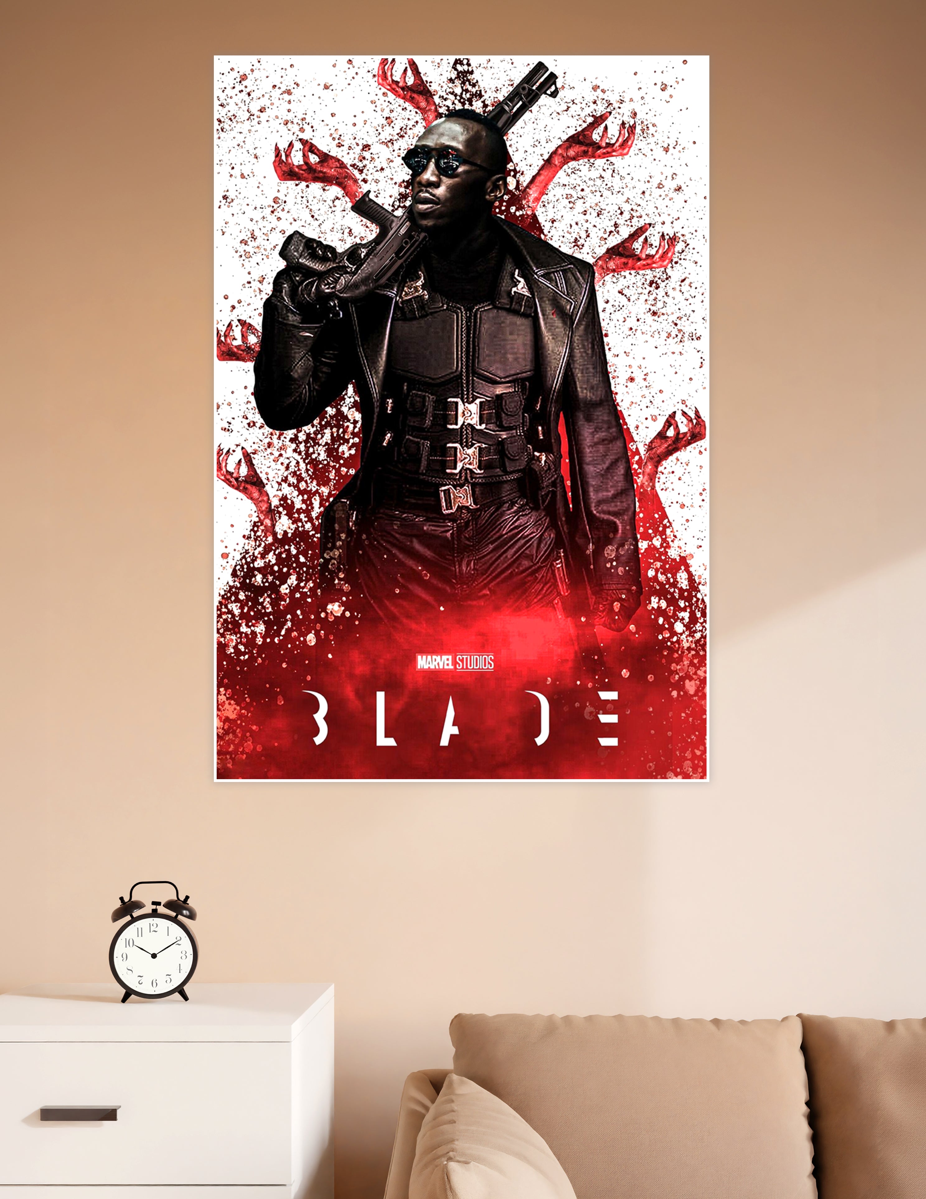 Marvel Studios Blade movie poster featuring the vampire hunter in black leather tactical gear holding a gun, surrounded by red vampire claws and blood splatter on a white background