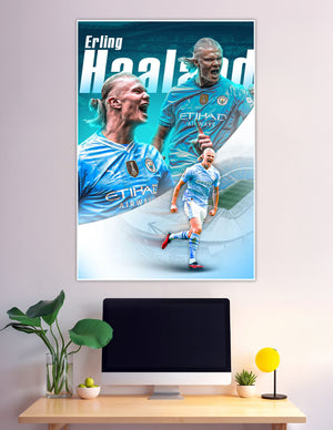 Erling Haaland celebrating in Manchester City blue kit