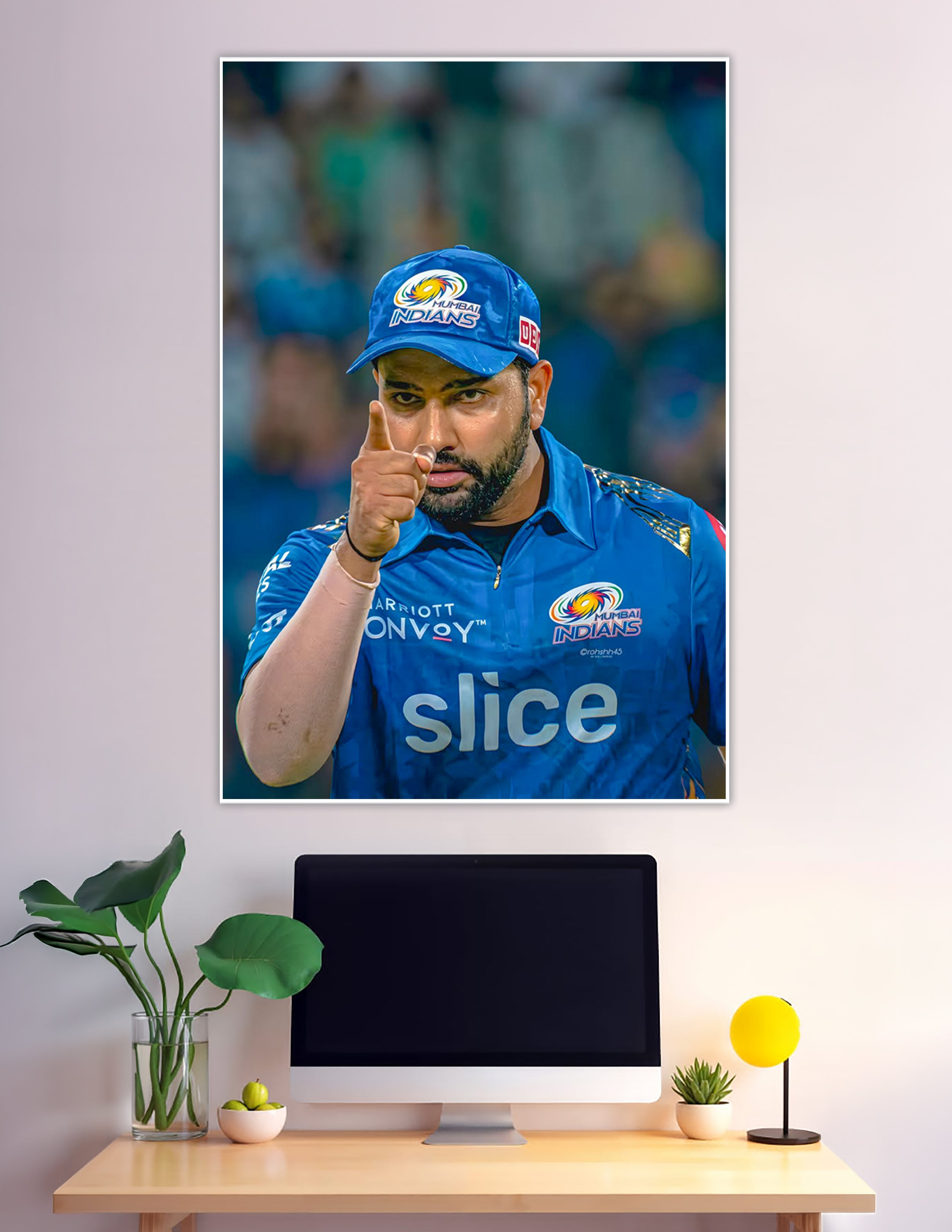 Mumbai Indians player pointing in blue IPL jersey poster