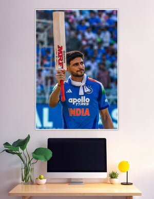 Indian cricket batsman raising MRF bat in stadium celebration