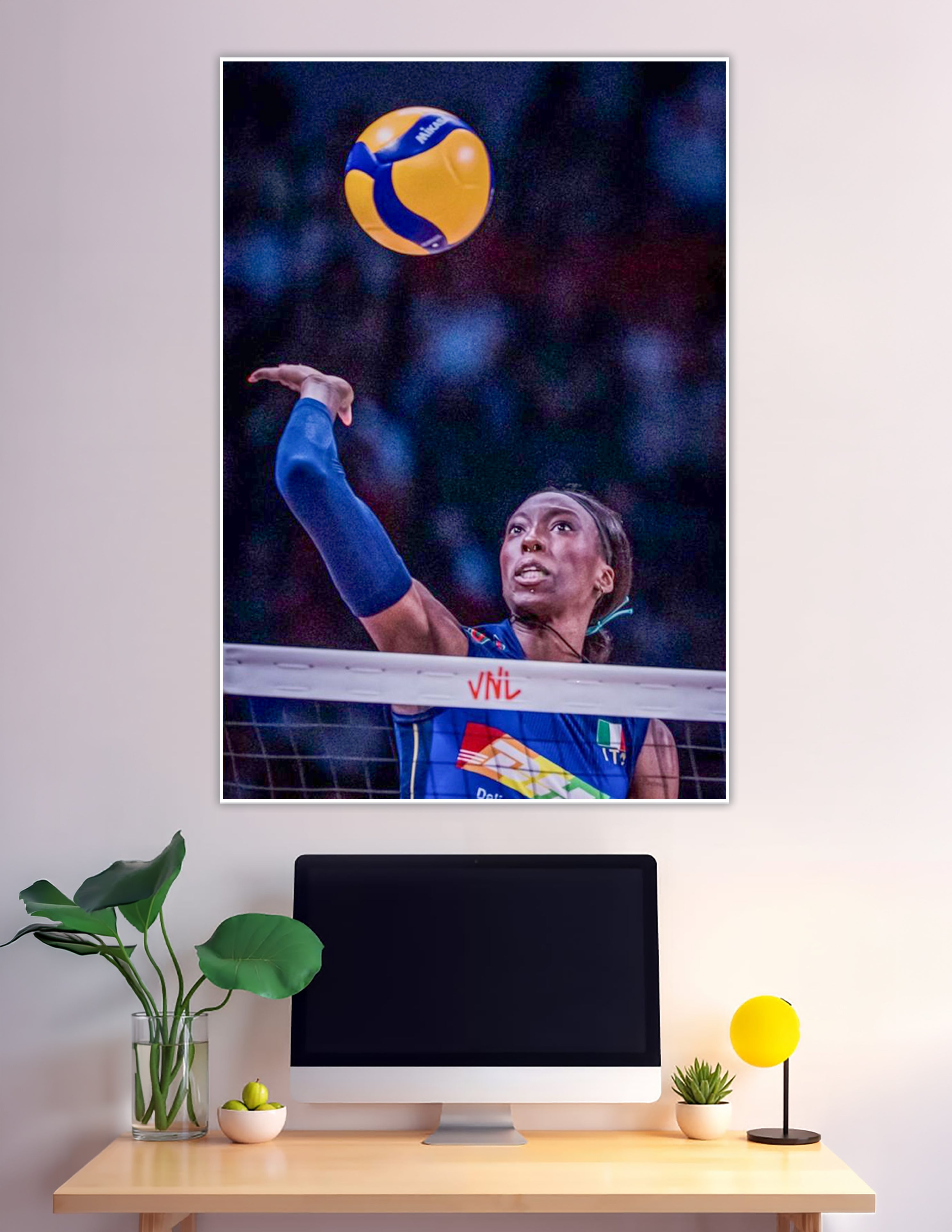 Italian female volleyball player reaching ball at VNL net