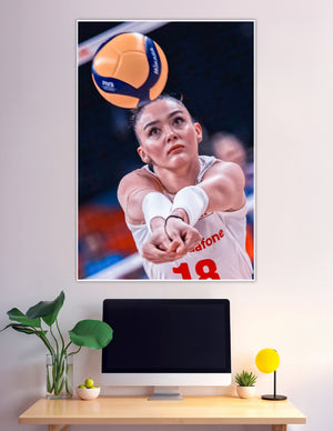 Female volleyball player number 18 digging Mikasa ball