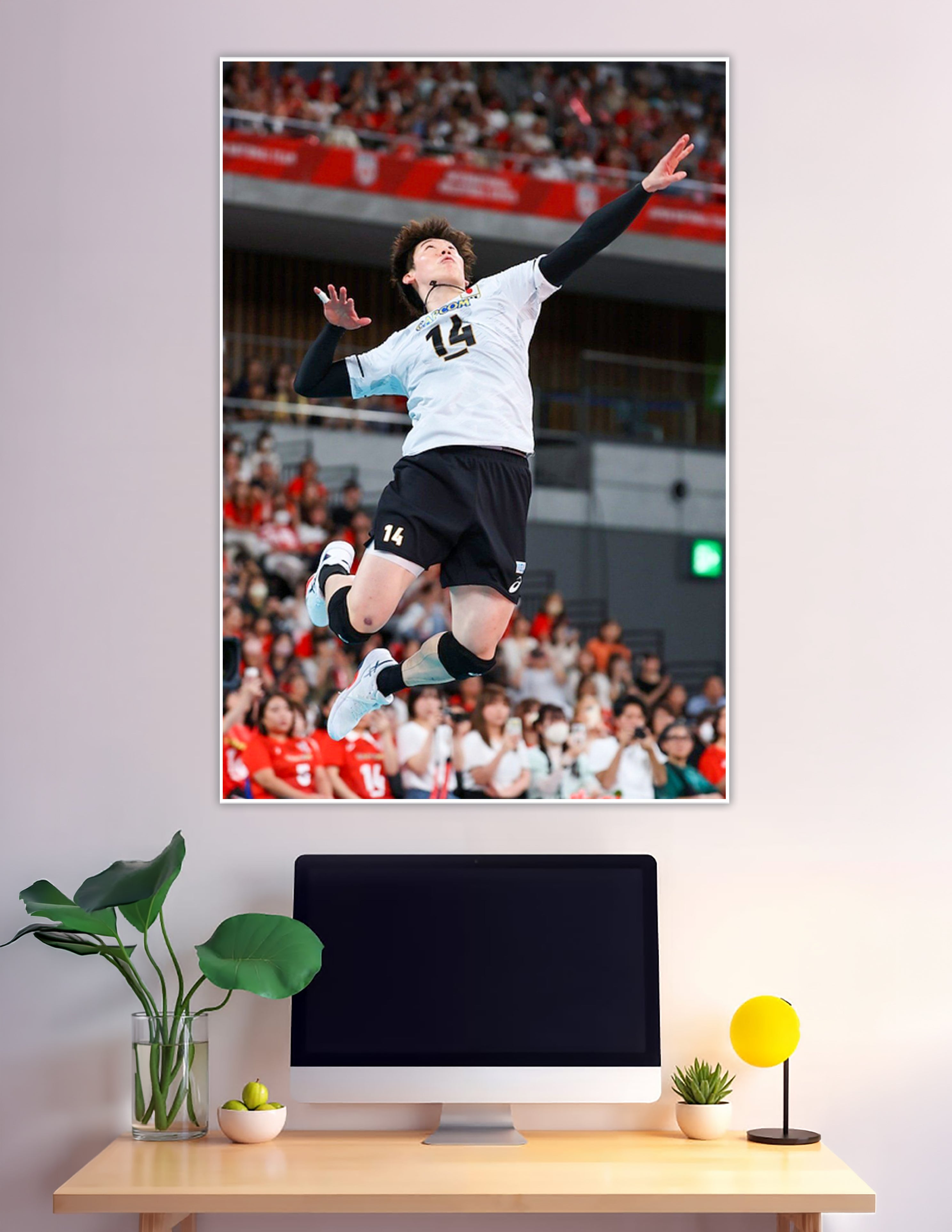 Volleyball player number 14 jumping mid-air in stadium