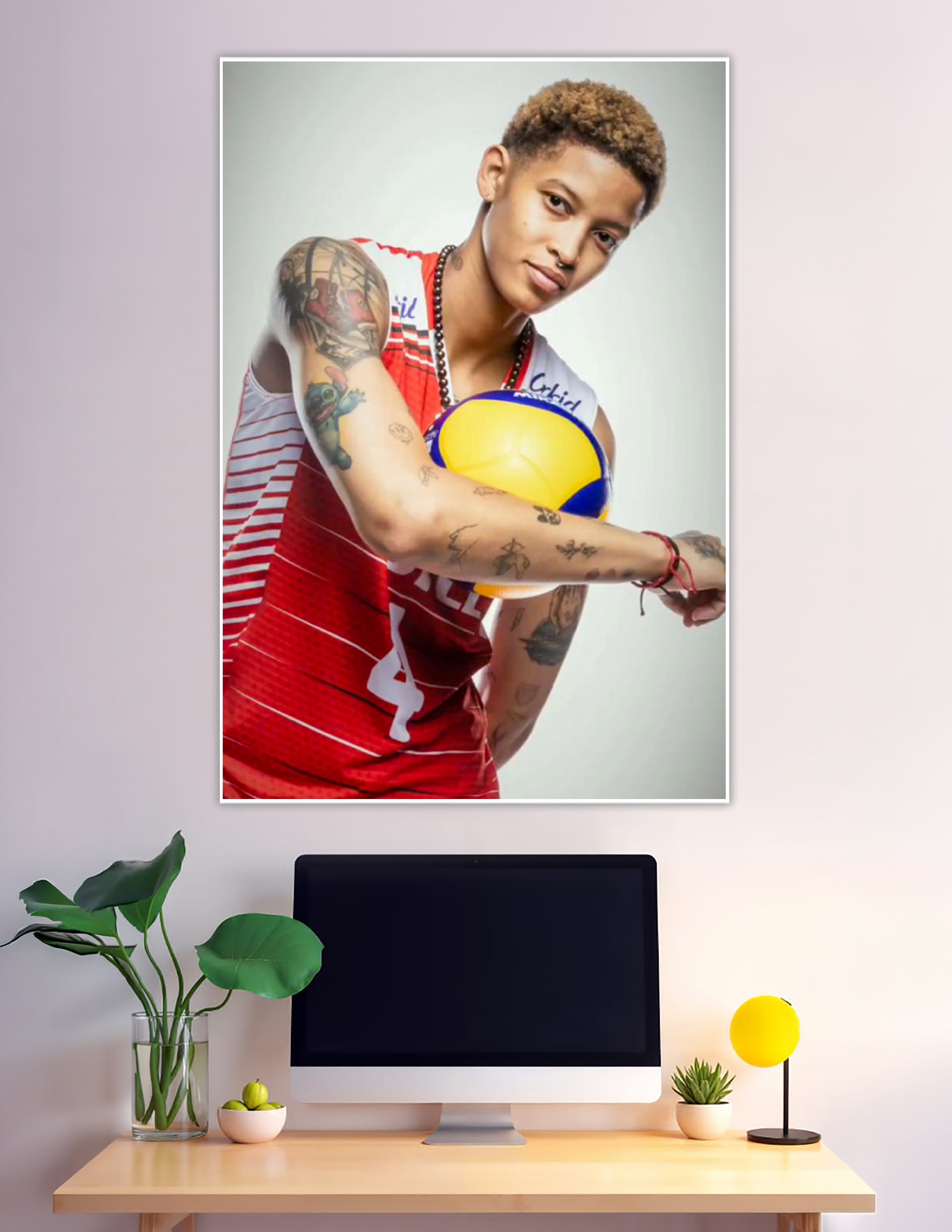 Tattooed volleyball player in red jersey holding Mikasa ball