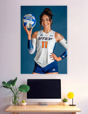UTEP Miners volleyball player number 11 holding NCAA ball