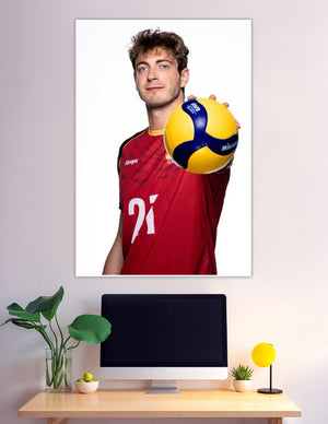 Volleyball player number 21 red jersey holding Mikasa ball