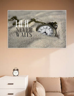 Vintage brass pocket watch resting in sand with bold 'Time Never Waits' motivational typography poster print