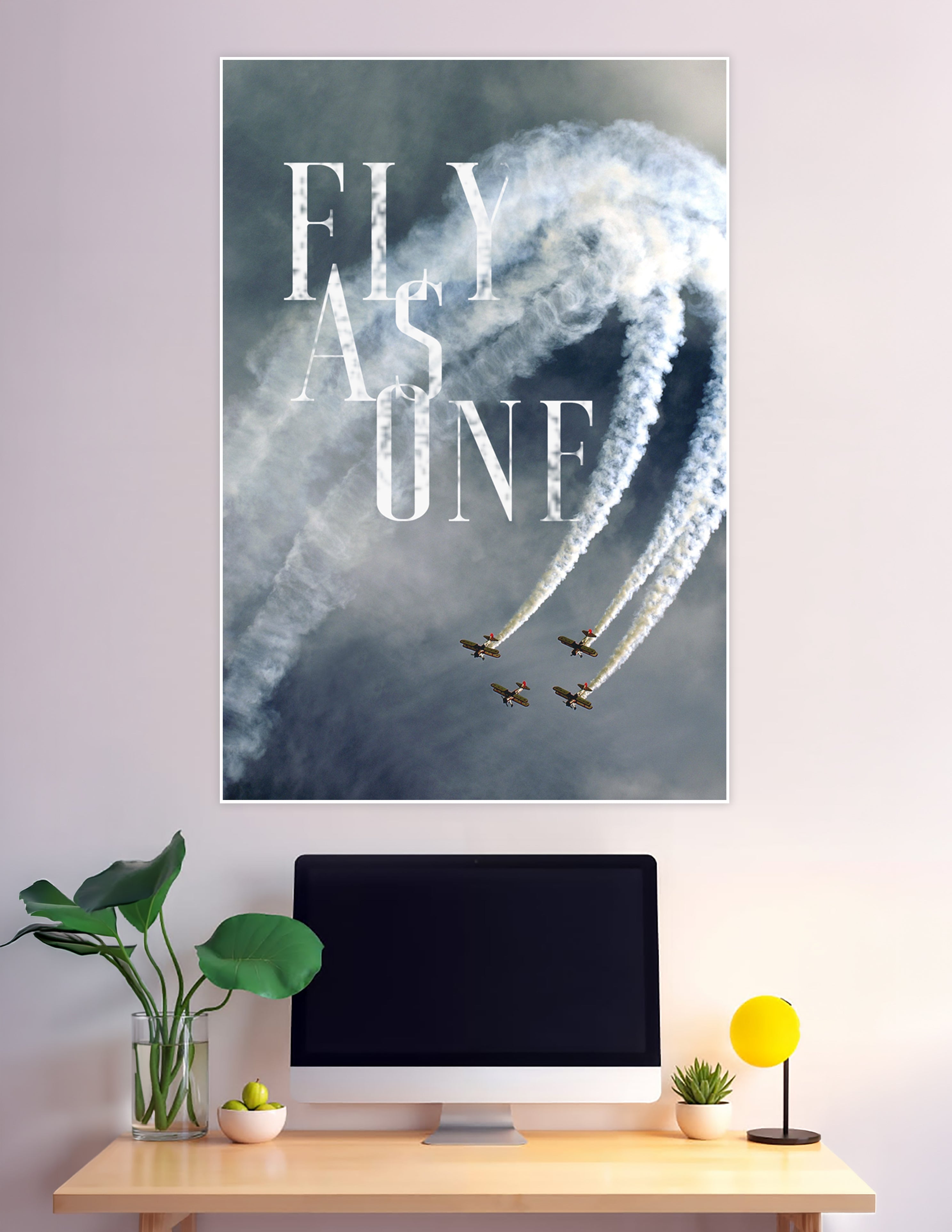 Four biplanes flying in tight formation with white smoke trails against a stormy sky, overlaid with bold 'Fly As One' typography