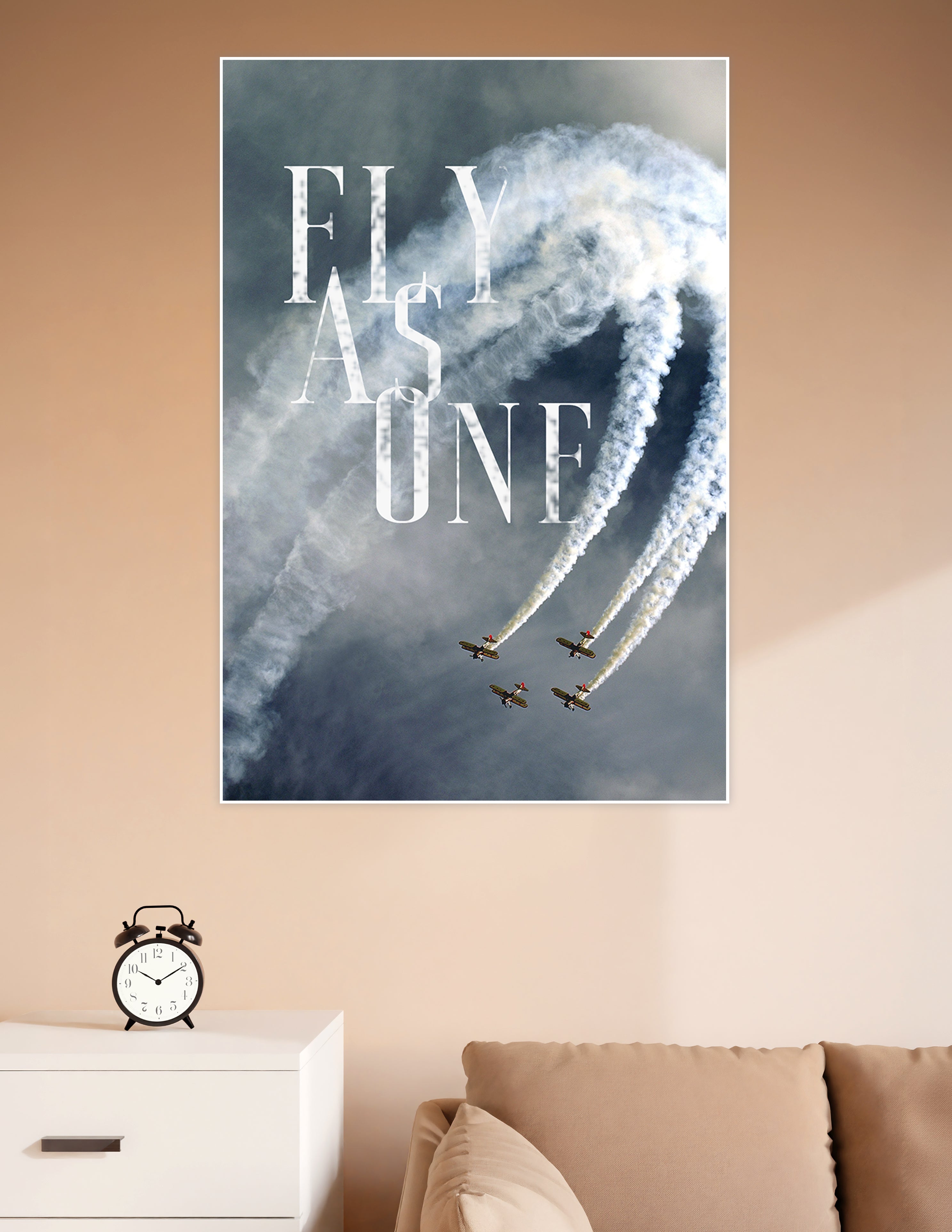 Four biplanes flying in tight formation with white smoke trails against a stormy sky, overlaid with bold 'Fly As One' typography