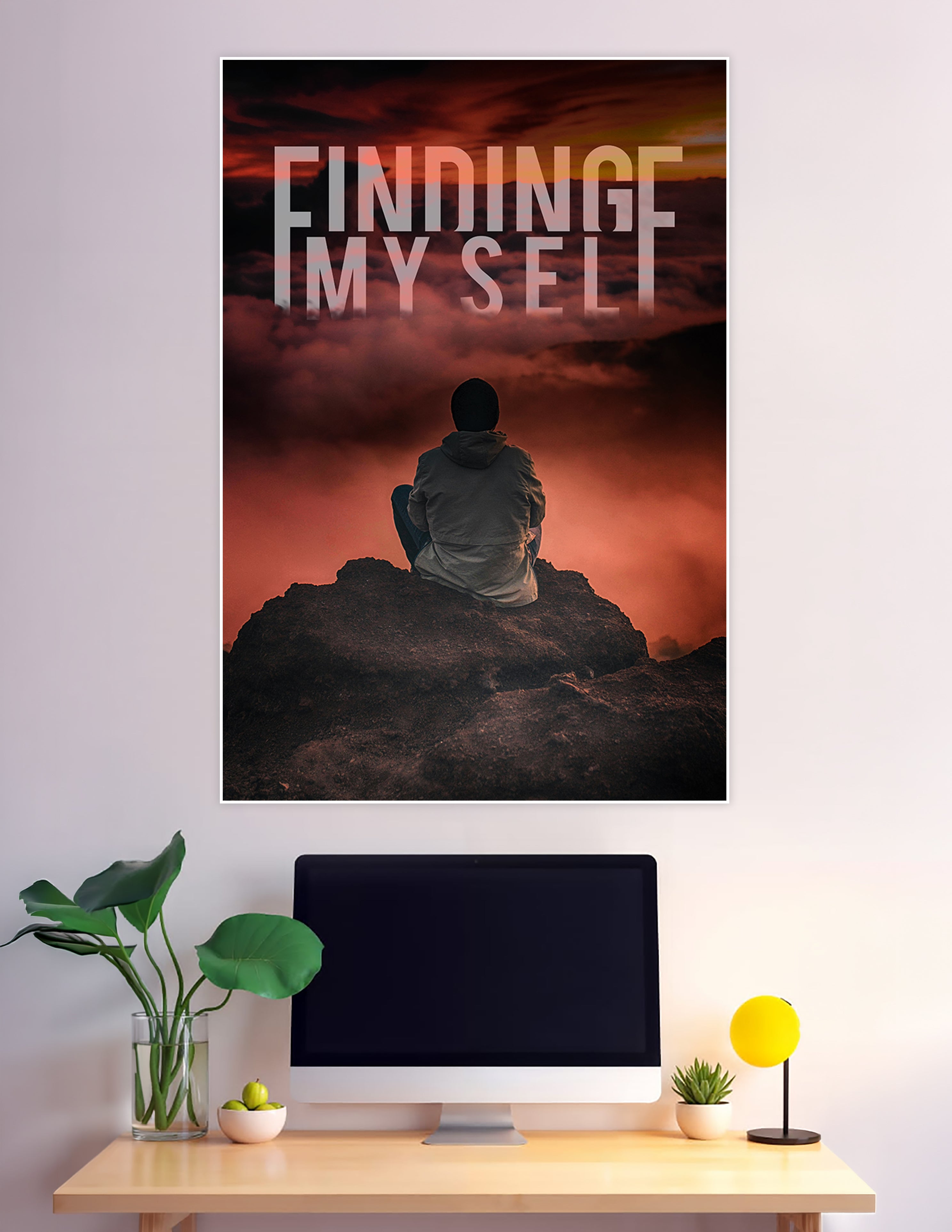 A lone figure sitting on a dark rocky summit gazing into a dramatic crimson cloudy sky with the text Finding Myself overlaid in large bold letters