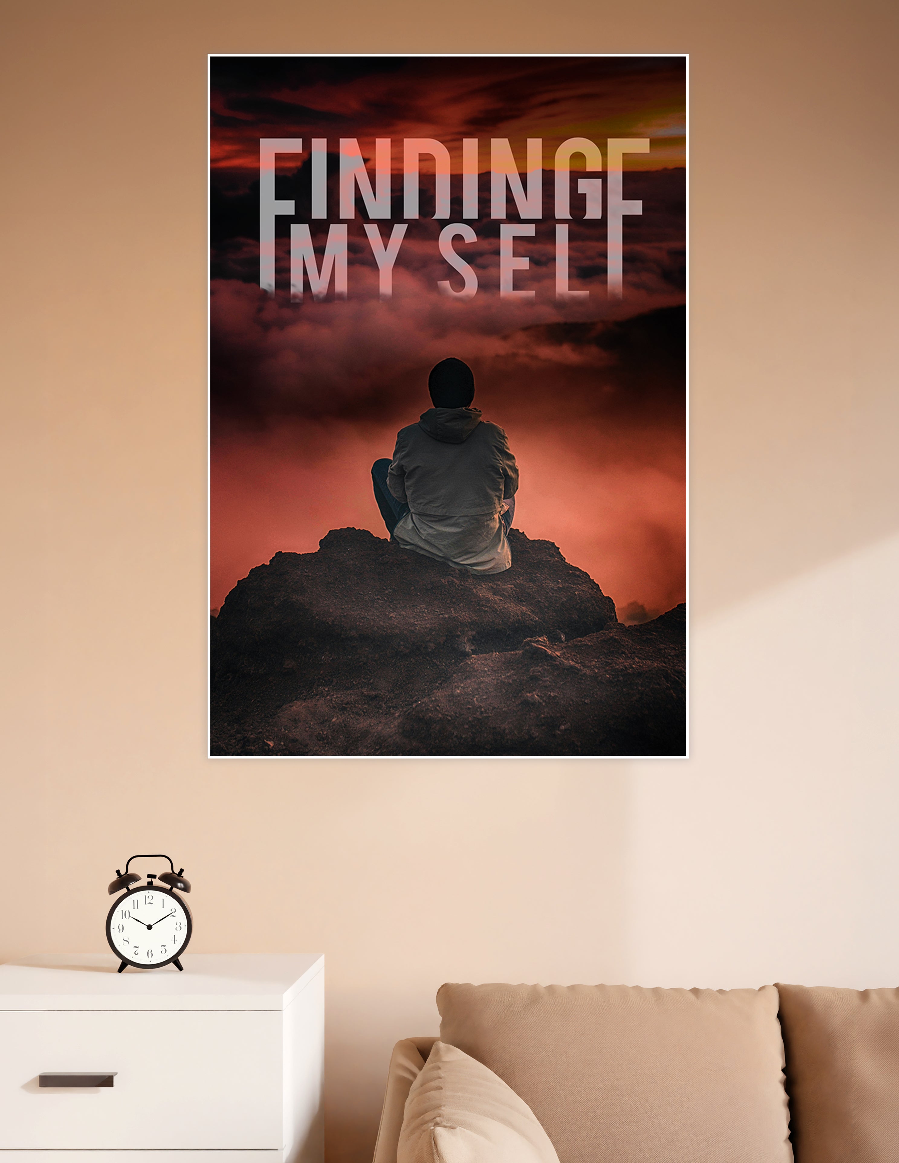 A lone figure sitting on a dark rocky summit gazing into a dramatic crimson cloudy sky with the text Finding Myself overlaid in large bold letters