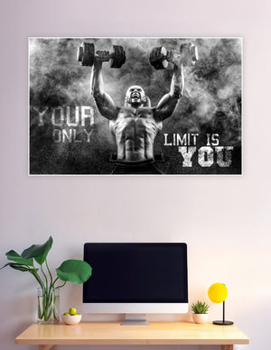 Black and white motivational gym poster of a muscular bald man lifting dumbbells overhead through smoke with the text Your Only Limit Is You