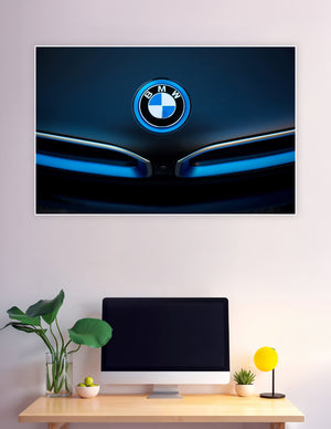 Close-up of glowing BMW roundel emblem in electric blue light on dark car hood — premium automotive wall poster