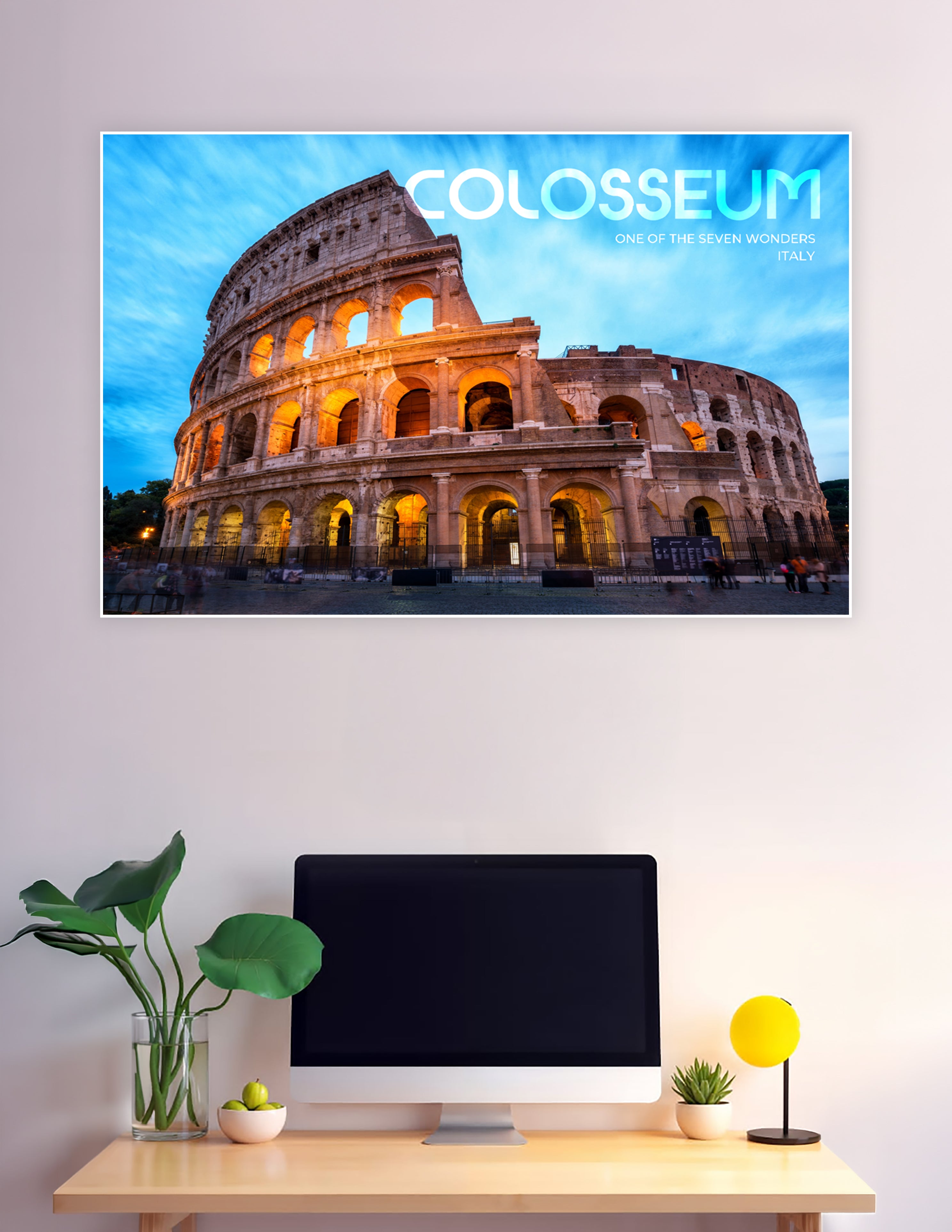 Dramatic twilight poster of the Colosseum in Rome, Italy, illuminated in golden light against a vivid blue sky, labeled as one of the Seven Wonders