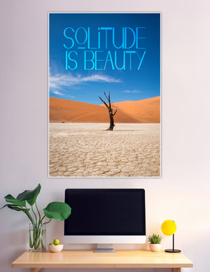 Lone dead tree in desert with solitude is beauty quote