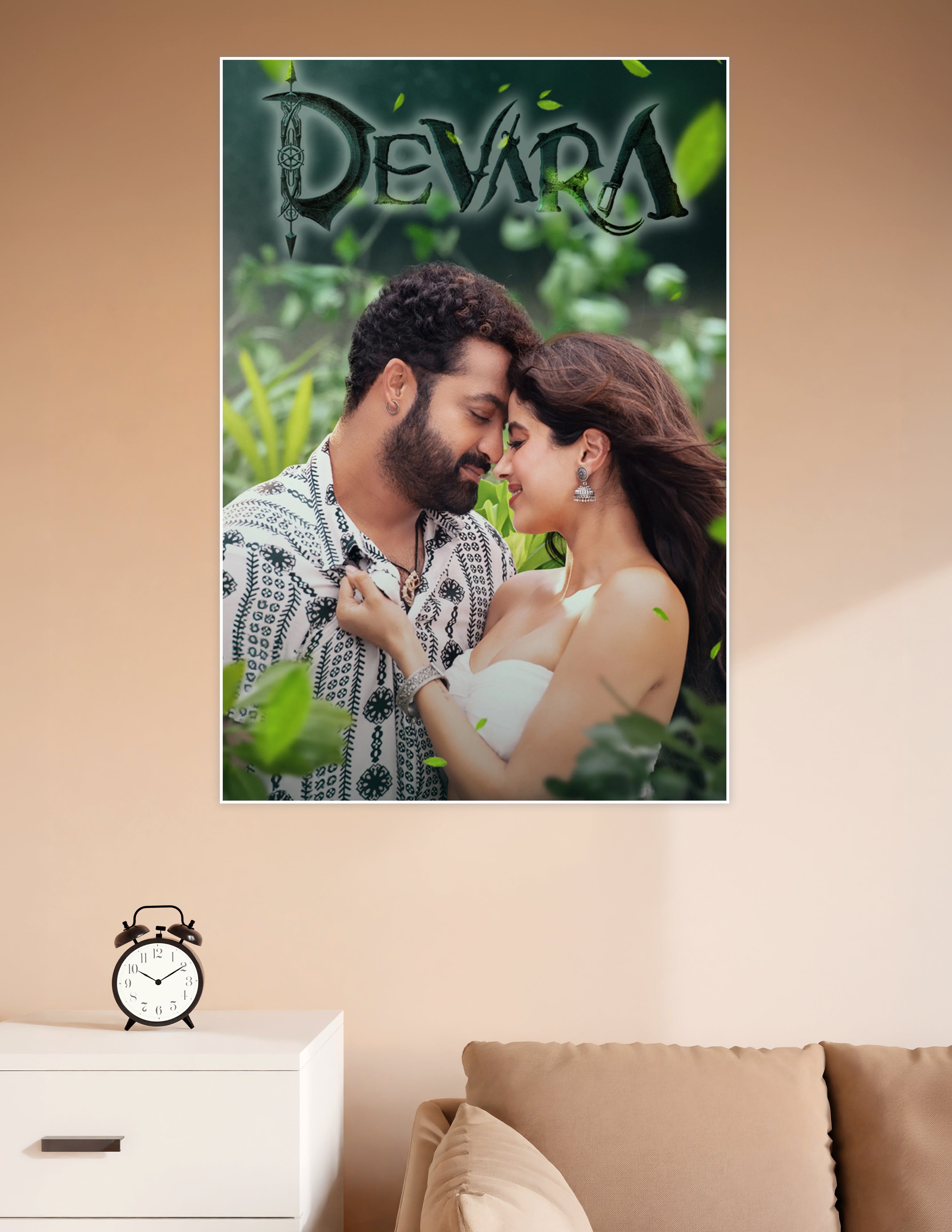 Devara movie poster featuring the romantic lead pair in an intimate moment surrounded by lush green foliage with the Devara title logo