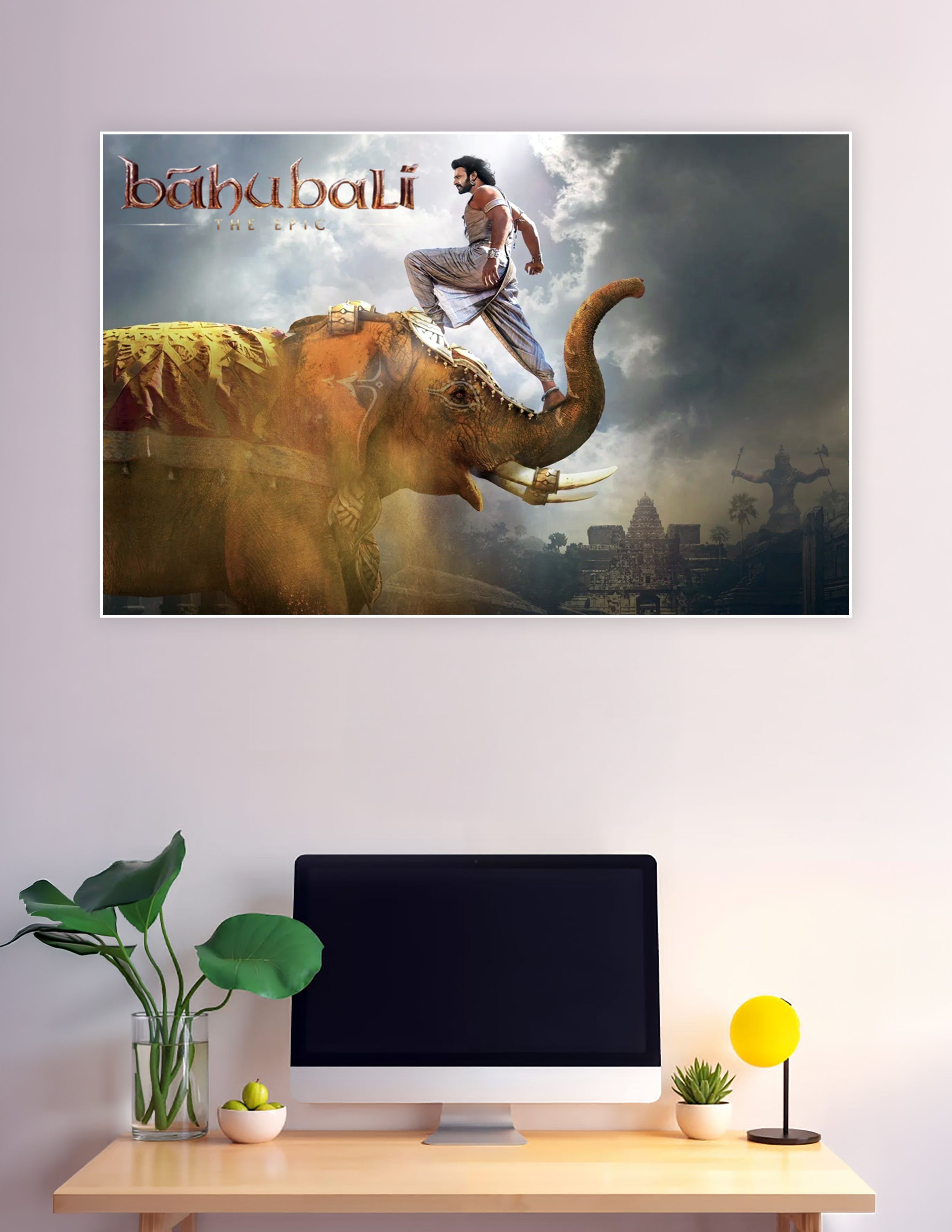 Baahubali The Epic movie poster showing a warrior standing on a decorated war elephant against a dramatic stormy sky with ancient temple silhouettes in the background