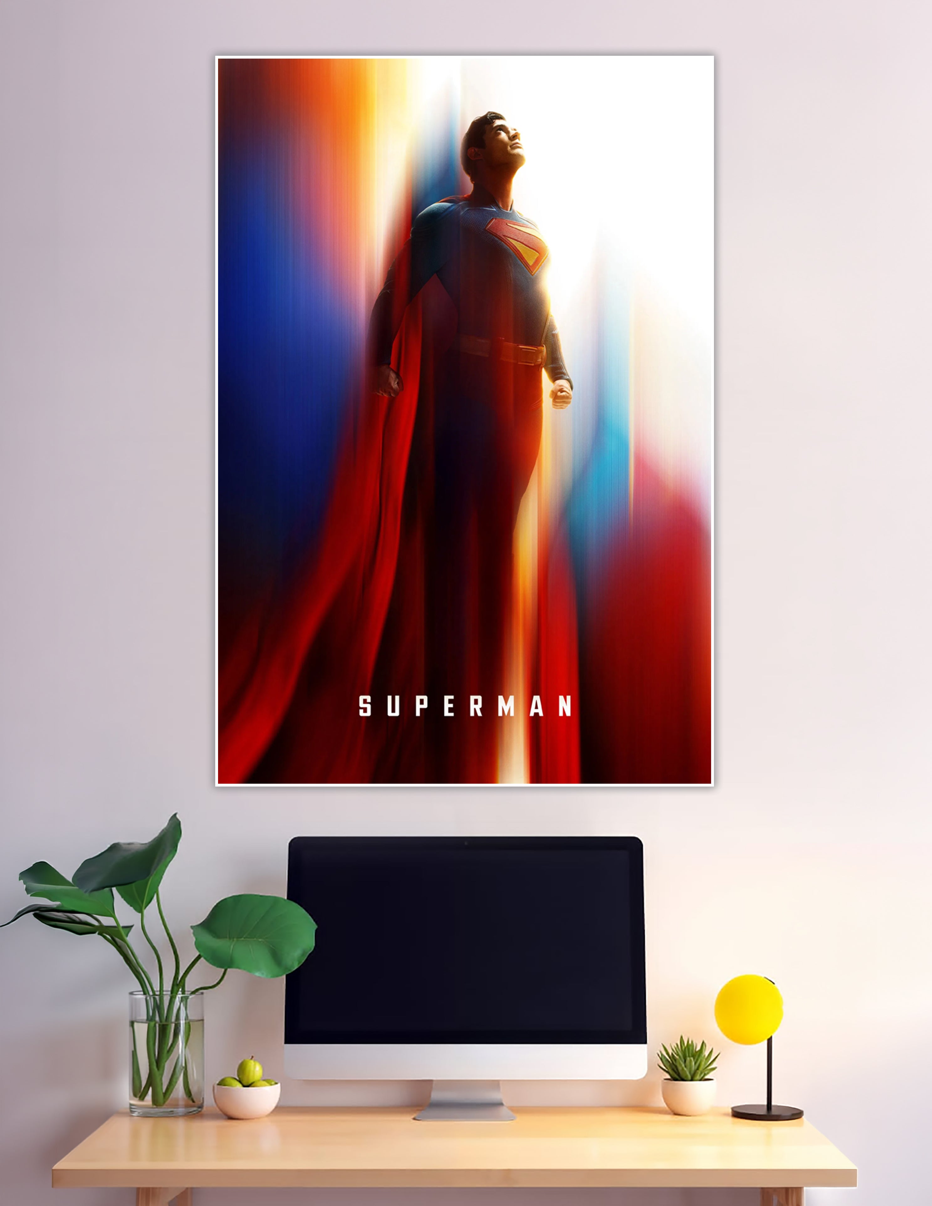 Superman standing in dramatic colorful light wearing iconic cape