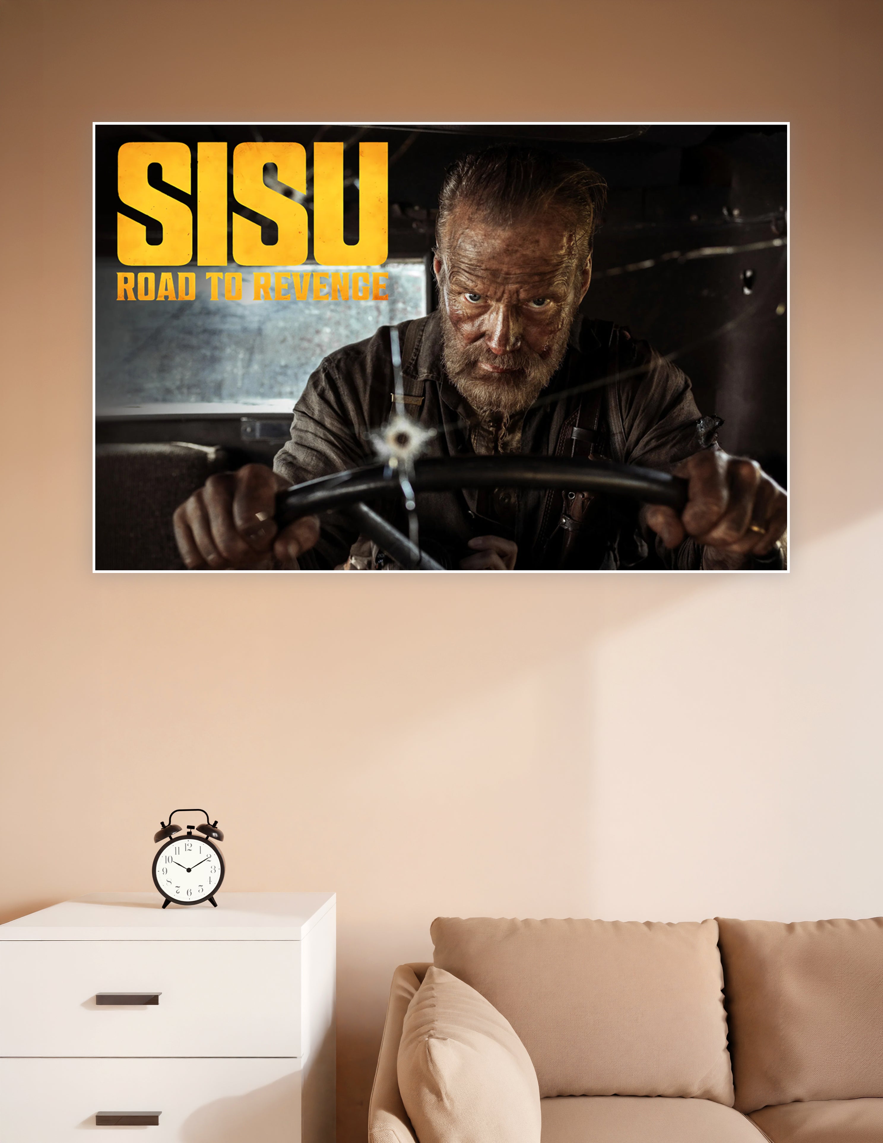 Sisu Road to Revenge movie poster showing a scarred warrior gripping a steering wheel with intense determination, bold yellow title text overlay