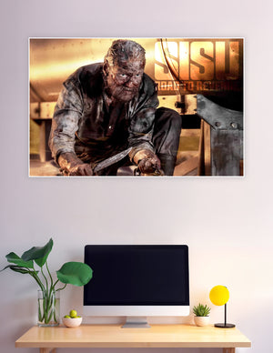Sisu Road to Revenge movie poster featuring a battle-scarred warrior crouching with a blade, covered in grime against a golden cinematic background