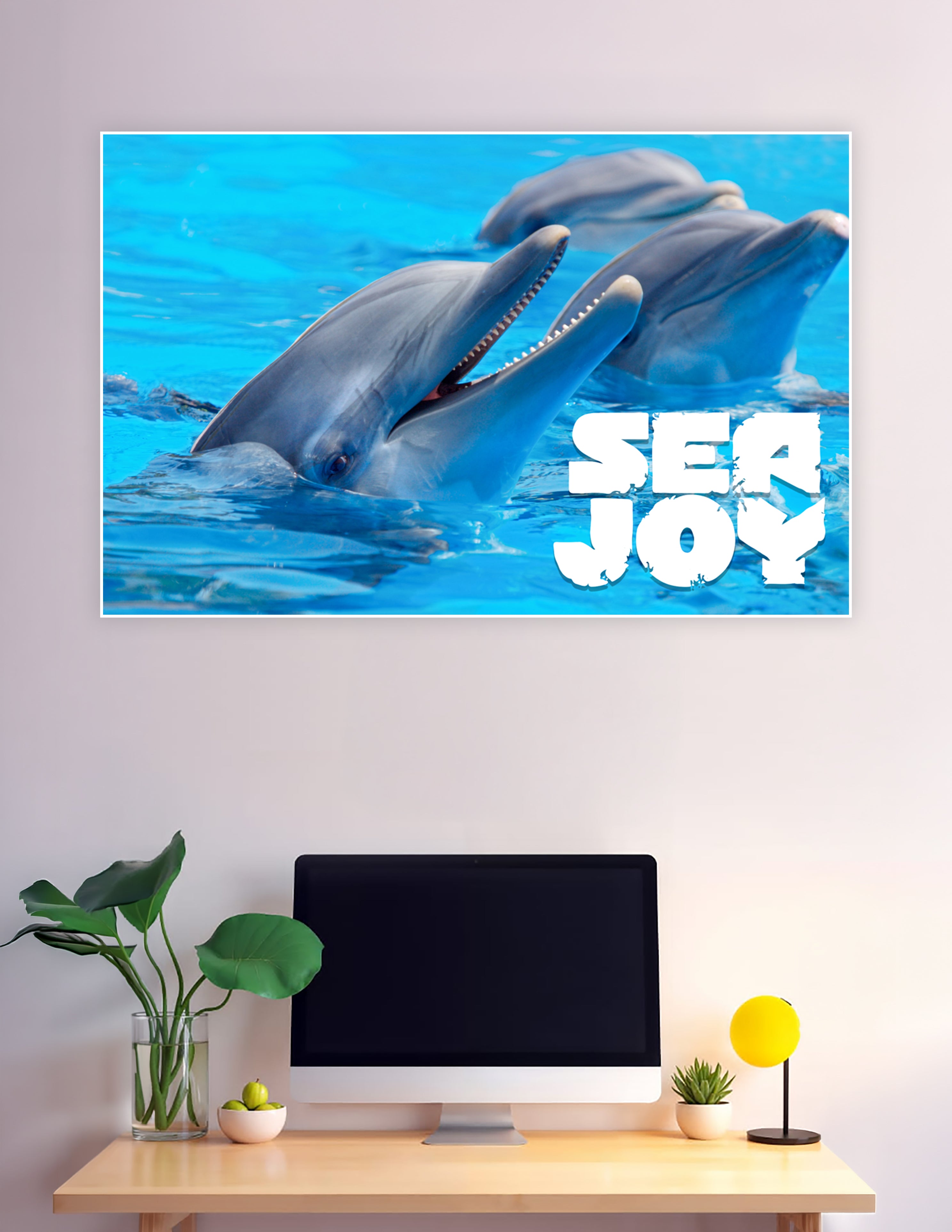 Two playful bottlenose dolphins emerging from bright blue water with Sea Joy text overlay, premium matte wall poster print
